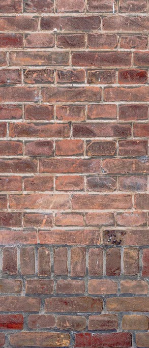 Duschrückwand - Mauerstruktur aus alten braunen Ziegeln