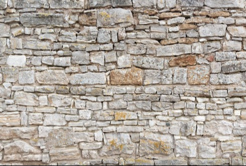 Küchenrückwand - Gräuliche alte Mauer aus groben Steinen