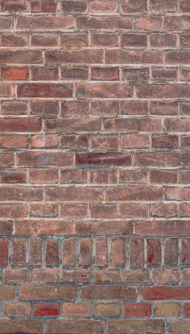 Duschrückwand - Mauerstruktur aus alten braunen Ziegeln