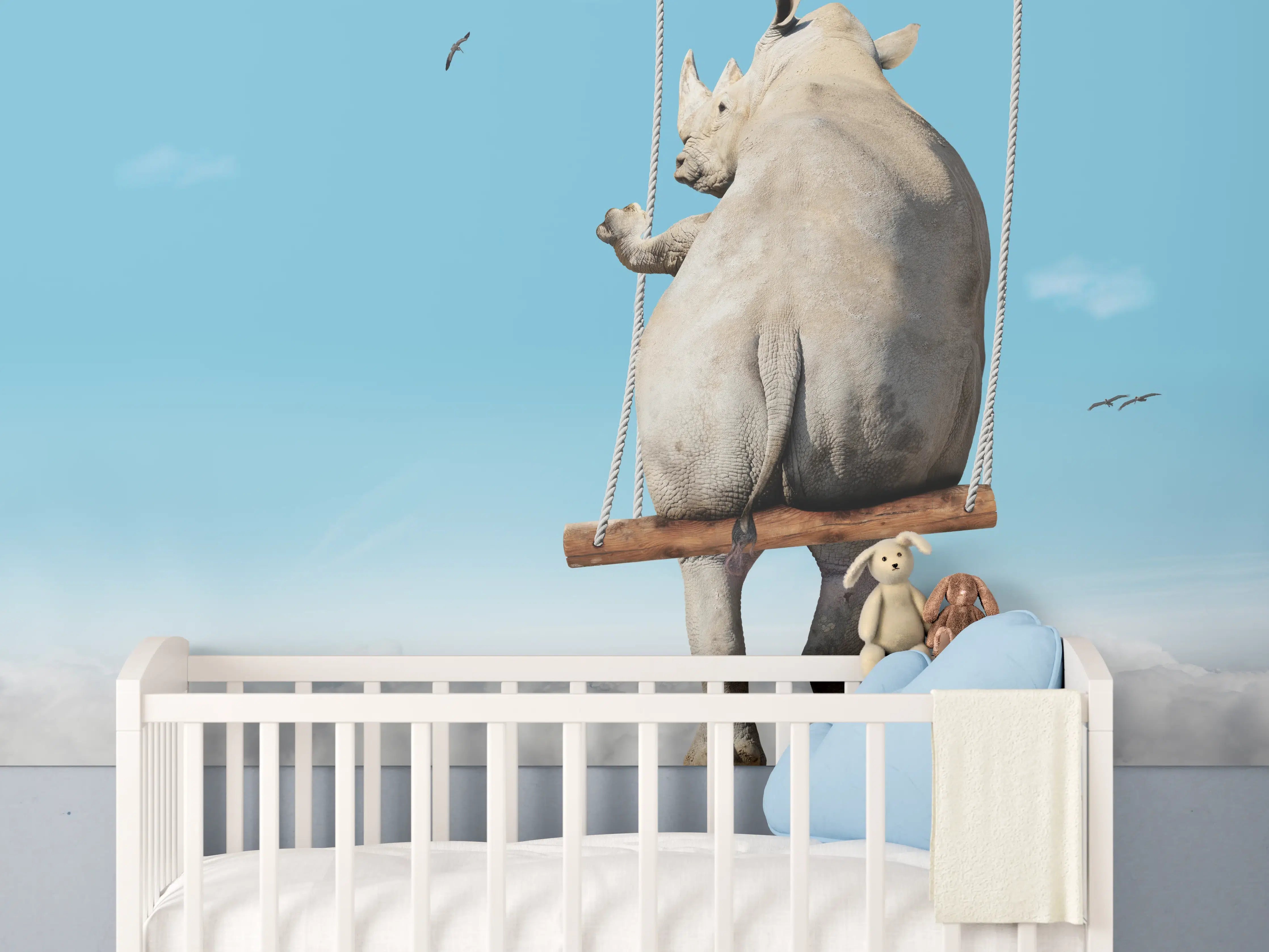 Babyzimmer Wandgestaltung - Nashorn schaukelt über den Wolken
