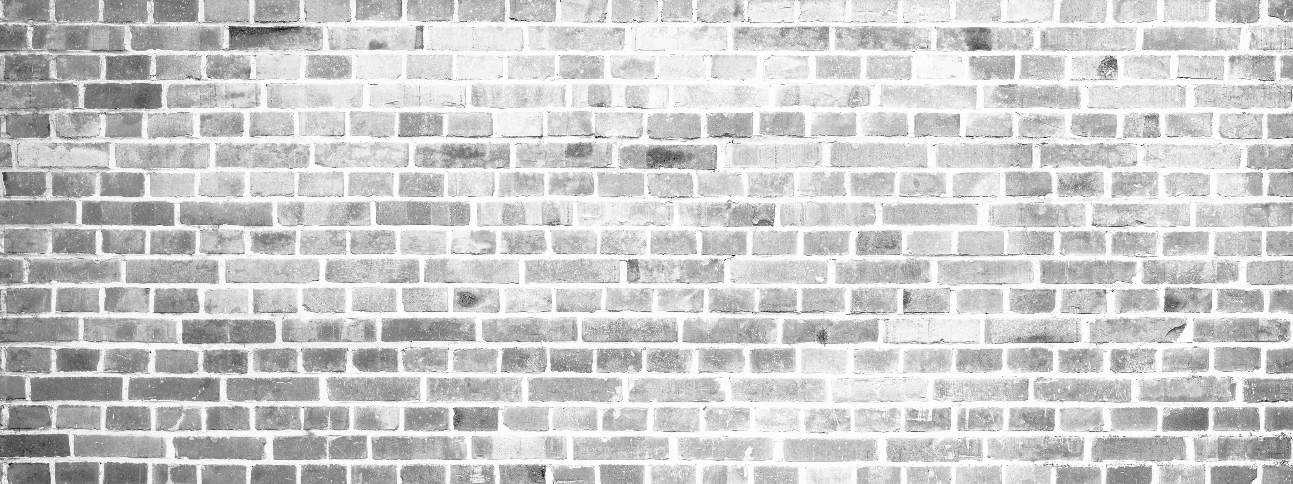 Büro Wandgestaltung-Weiße Ziegelsteinwand in Grautönen