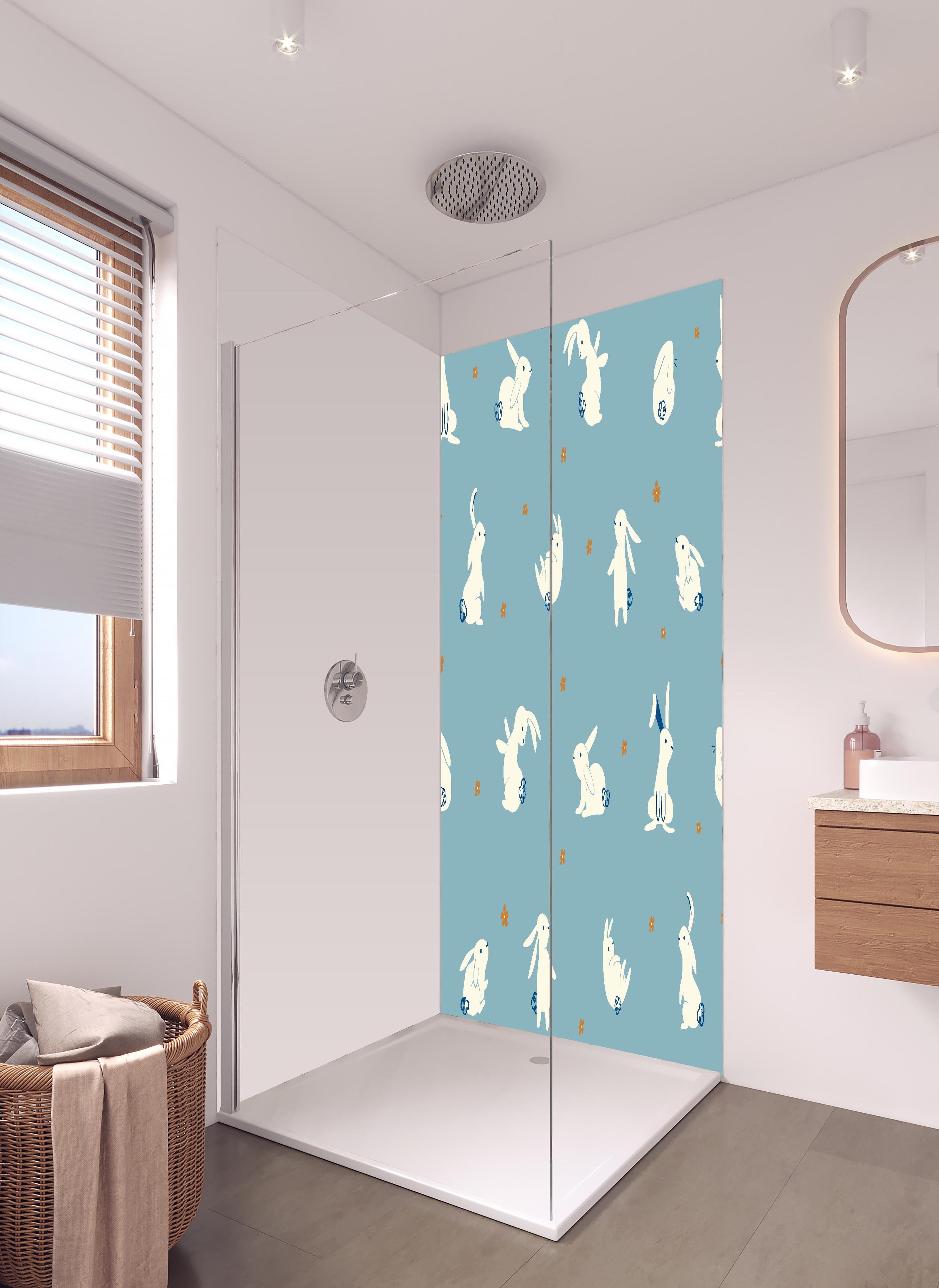 Duschrückwand - Süße Häschen auf Blau - Kinderstoffdesign in hellem Badezimmer mit Regenduschkopf - zweiteilige Eck-Duschrückwand
