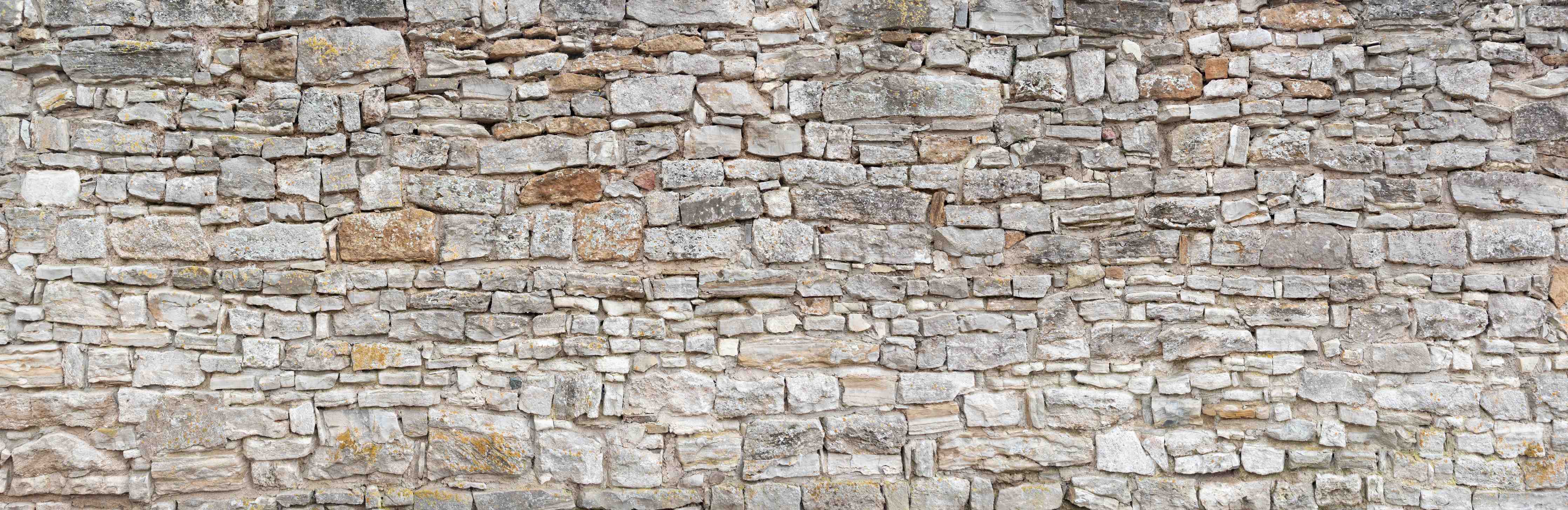 Kinderzimmer Wandgestaltung-Gräuliche alte Mauer aus groben Steinen