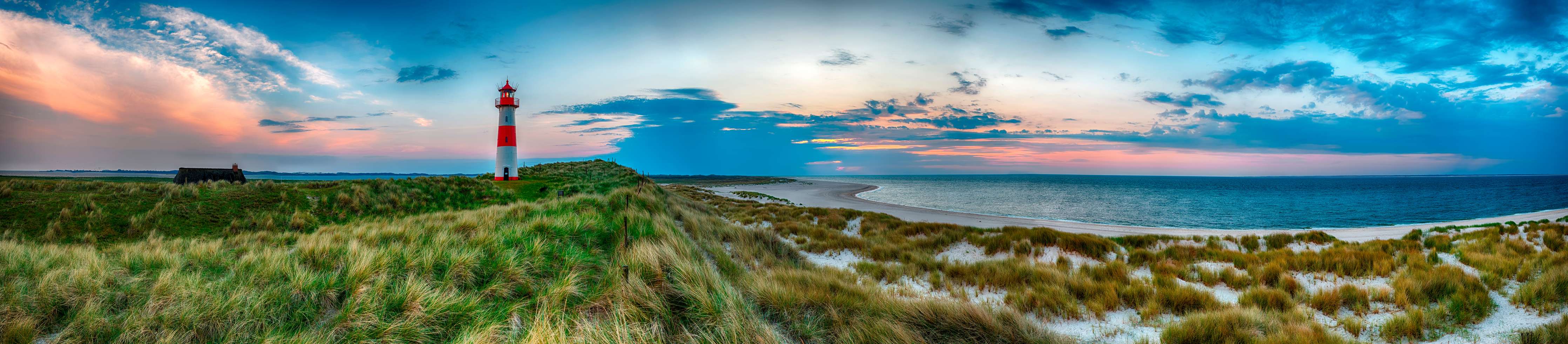 Kinderzimmer Wandgestaltung-Leuchtturm am Strand bei Sonnenuntergang