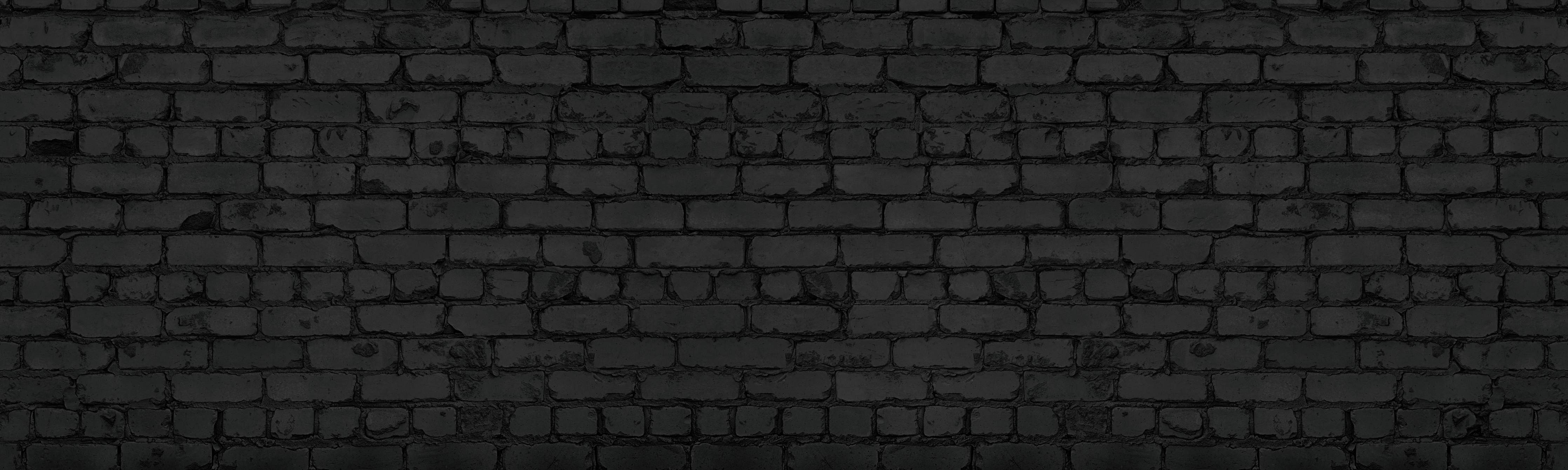 Kinderzimmer Wandgestaltung-Schwarze raue Backsteinmauer