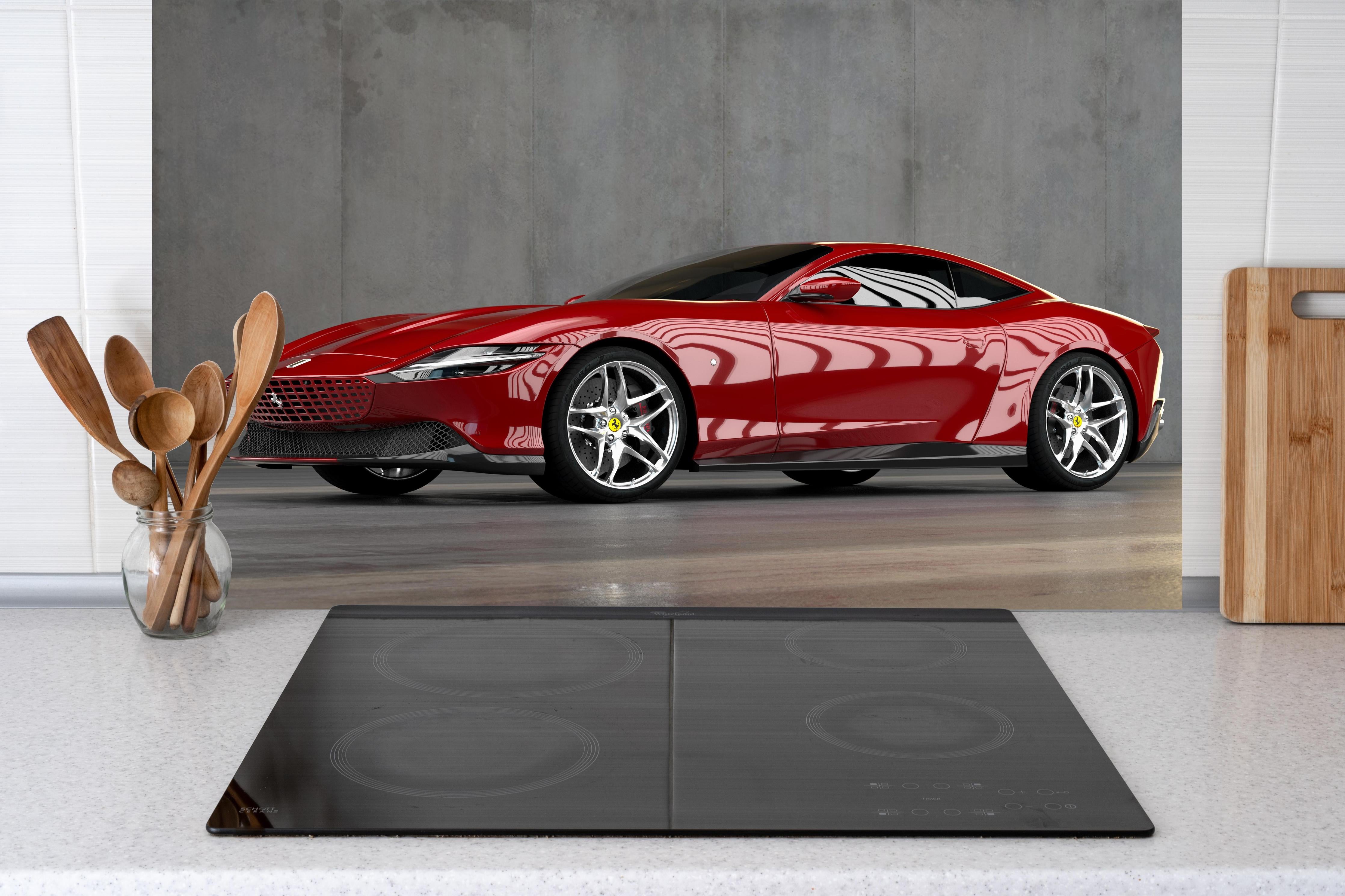 Küche - Ferrari Roma in Rosso Corsa hinter weißen Hochglanz-Küchenregalen und schwarzem Wasserhahn