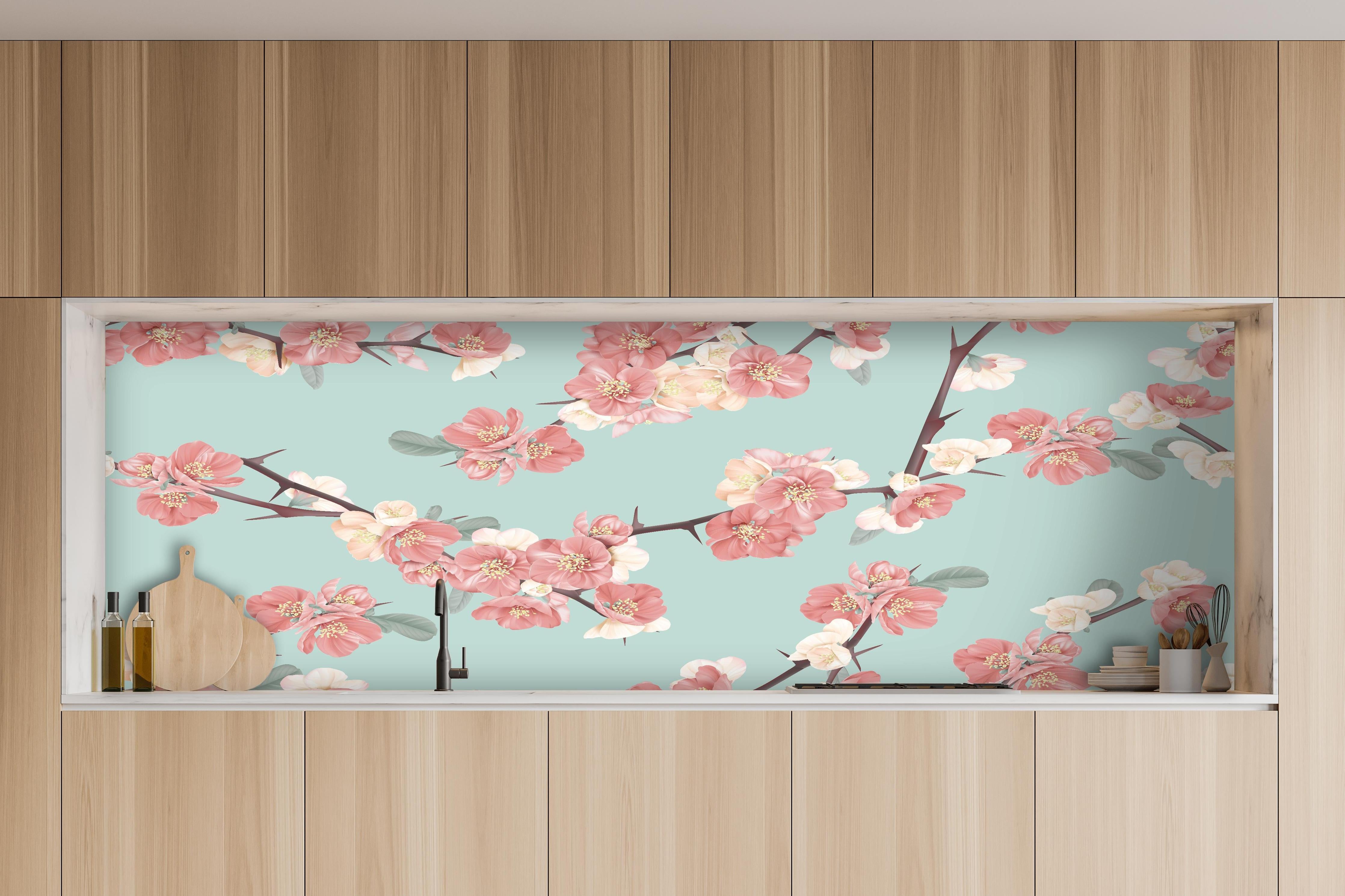 Küche - Japanische Quitten Blumen Muster Pastellblau hinter weißen Hochglanz-Küchenregalen und schwarzem Wasserhahn
