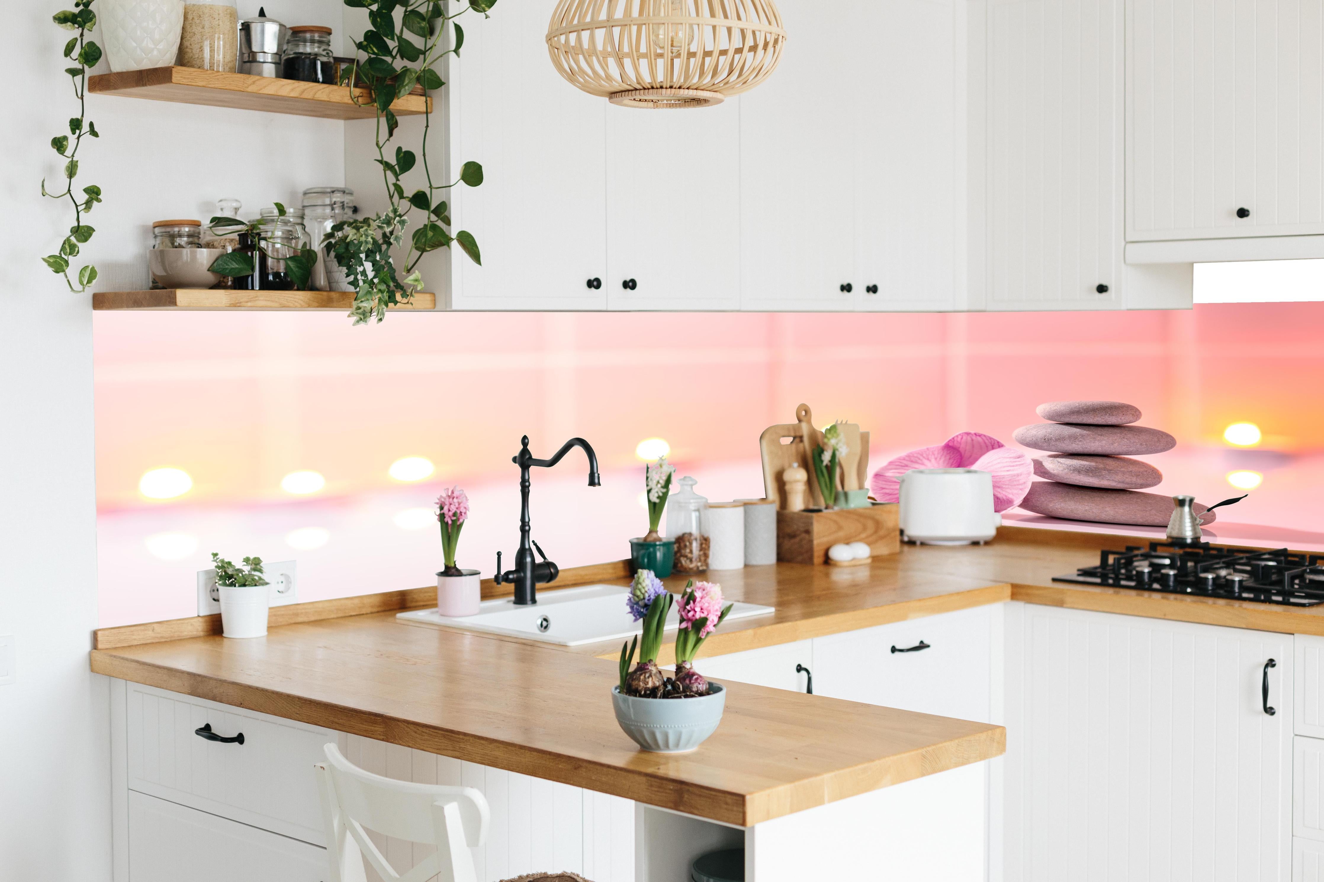 Küche - Rosa Orchidee mit Zen-Steinen in lebendiger Küche mit bunten Blumen