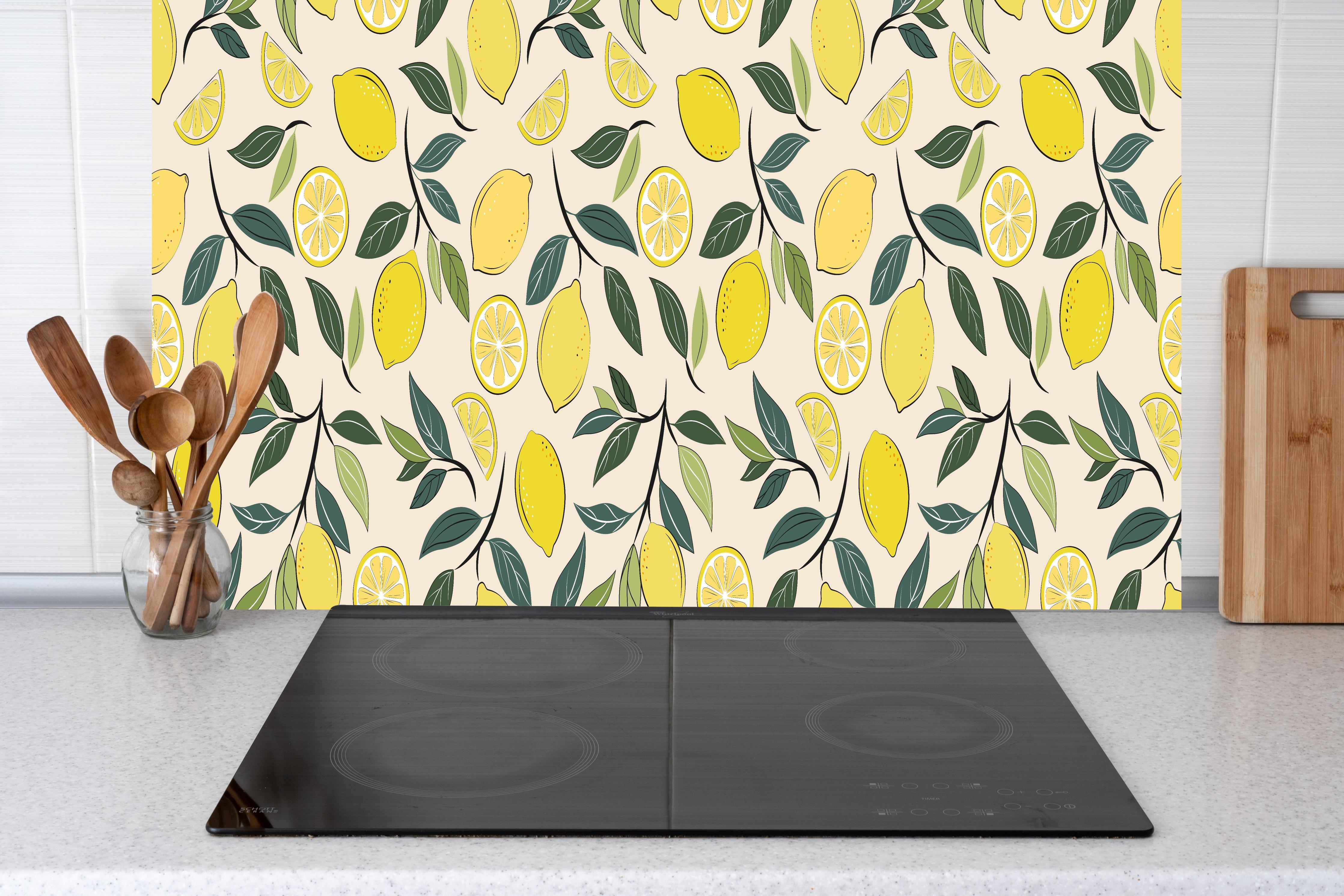 Küche - Sommerliches Zitronen-Design Gelb-Grün hinter Cerankochfeld und Holz-Kochutensilien