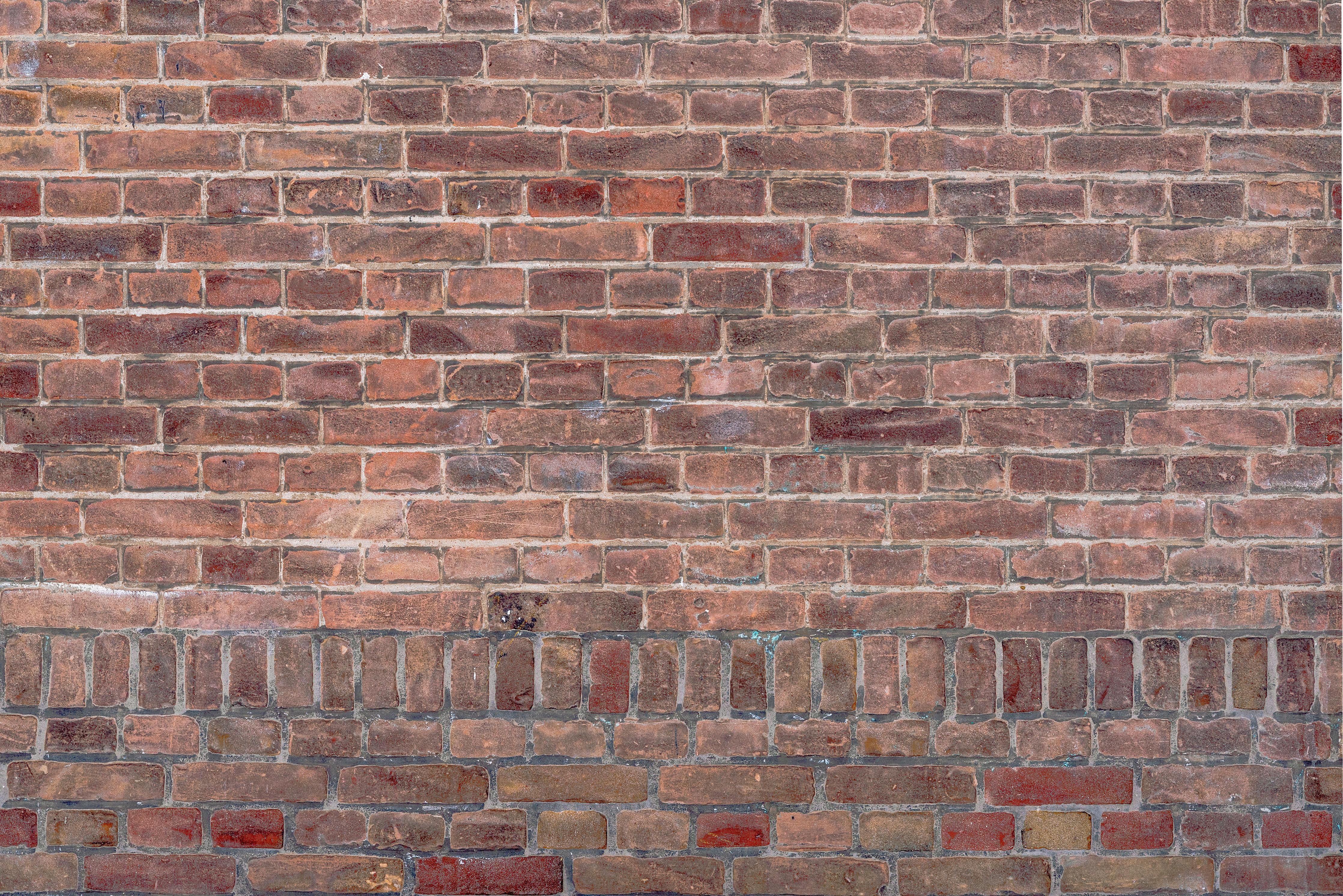 Küchenrückwand-Mauerstruktur aus alten braunen Ziegeln