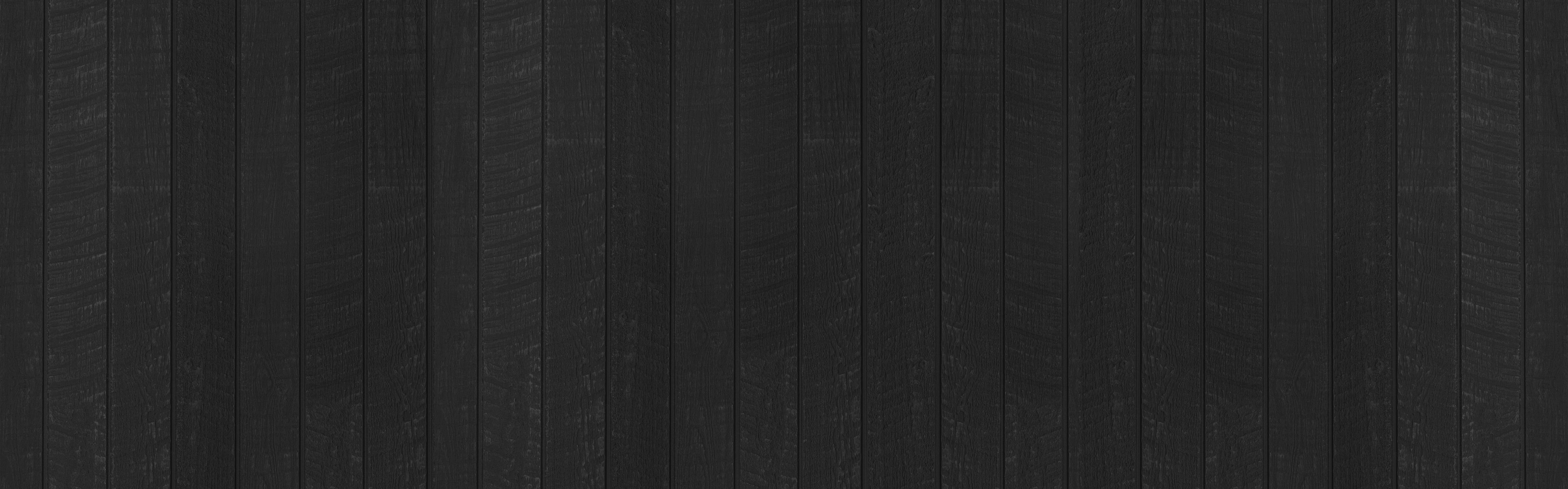 Küchenrückwand-Schwarzer Holzzaun mit vertikalen Holzbrättern