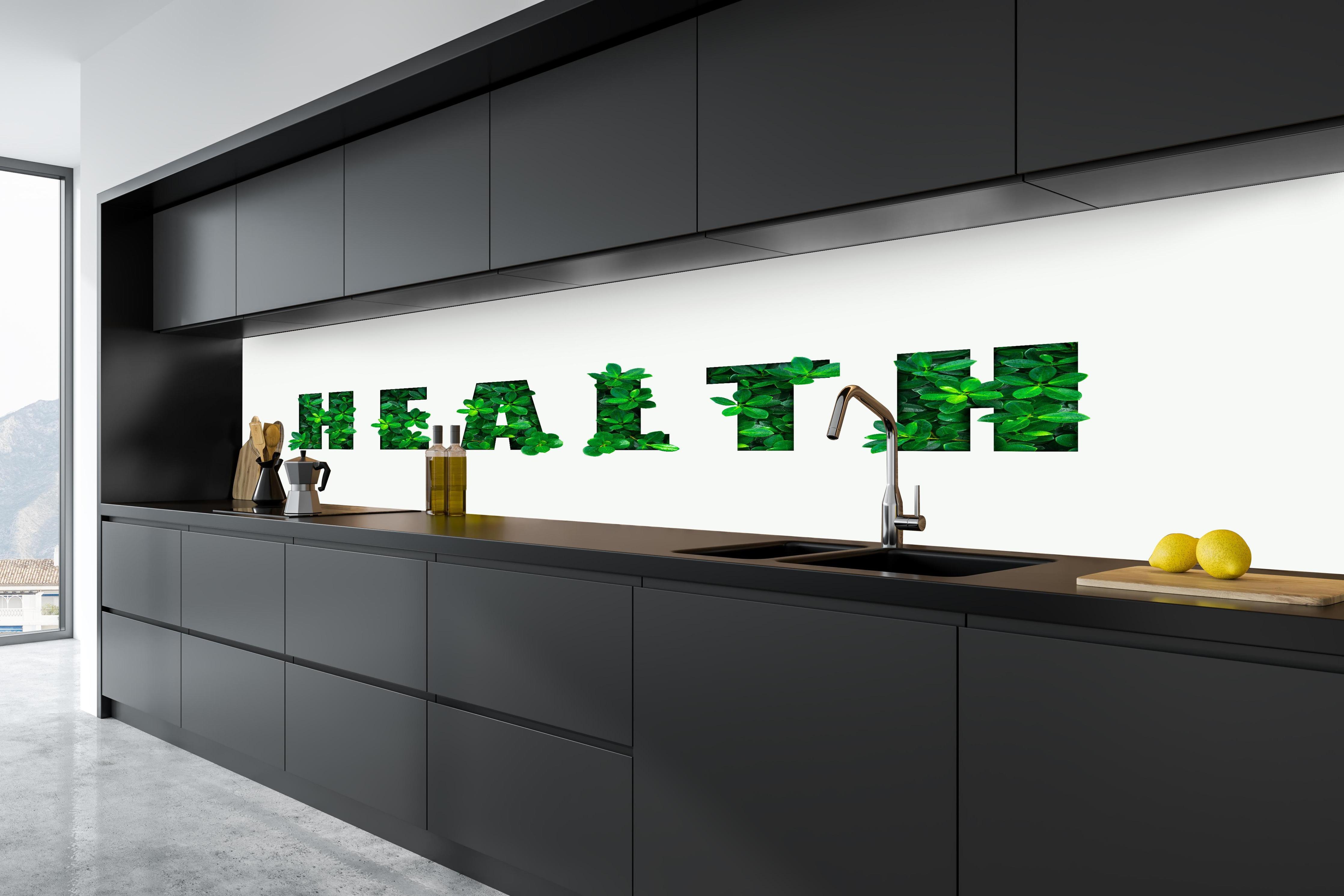 Küche - Wort HEALTH aus grünen Blättern in tiefschwarzer matt-premium Einbauküche