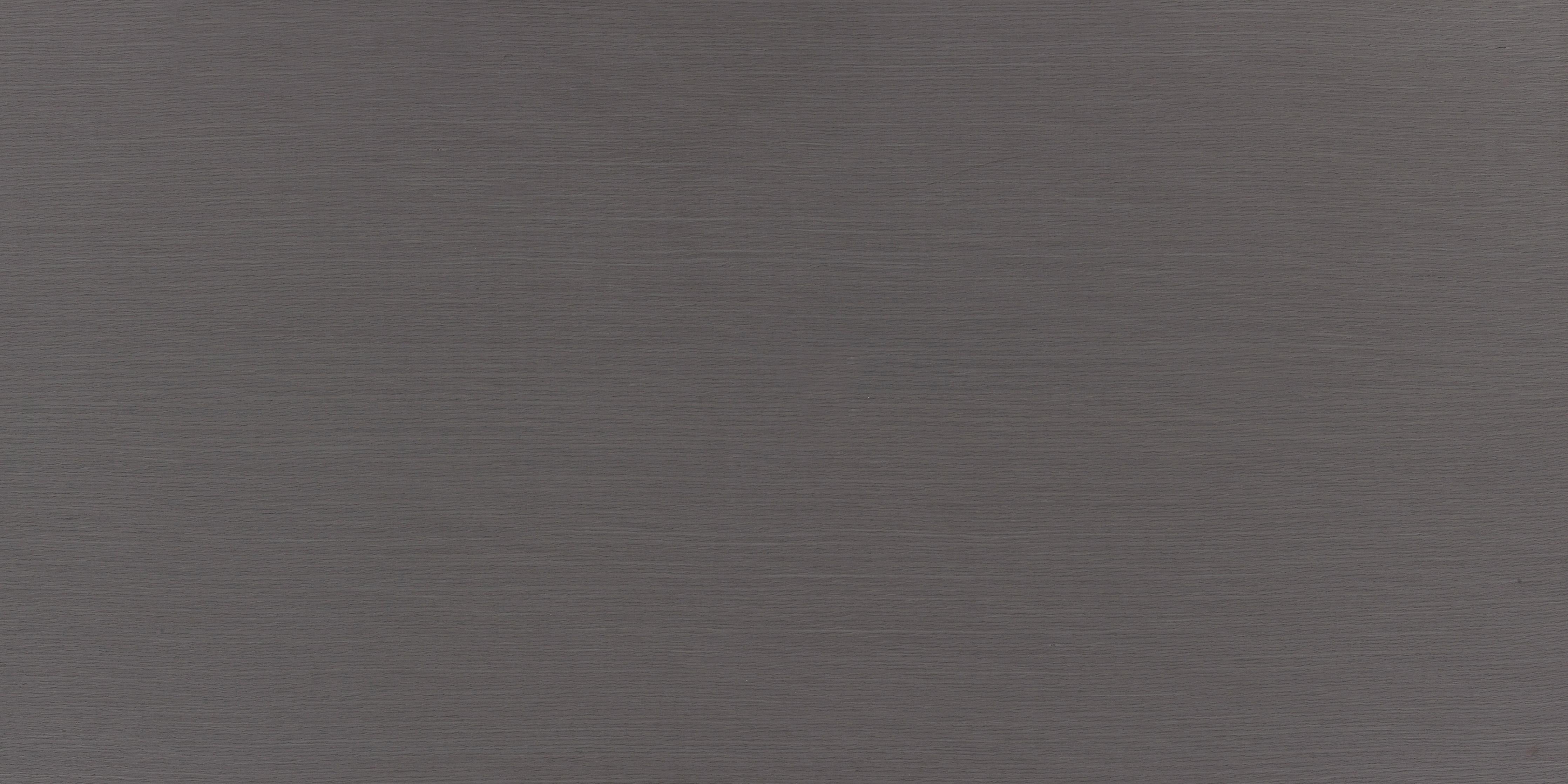 Küchenrückwand-Nahaufnahme einer grauen, strukturierten Oberfläche mit feinen Fasern