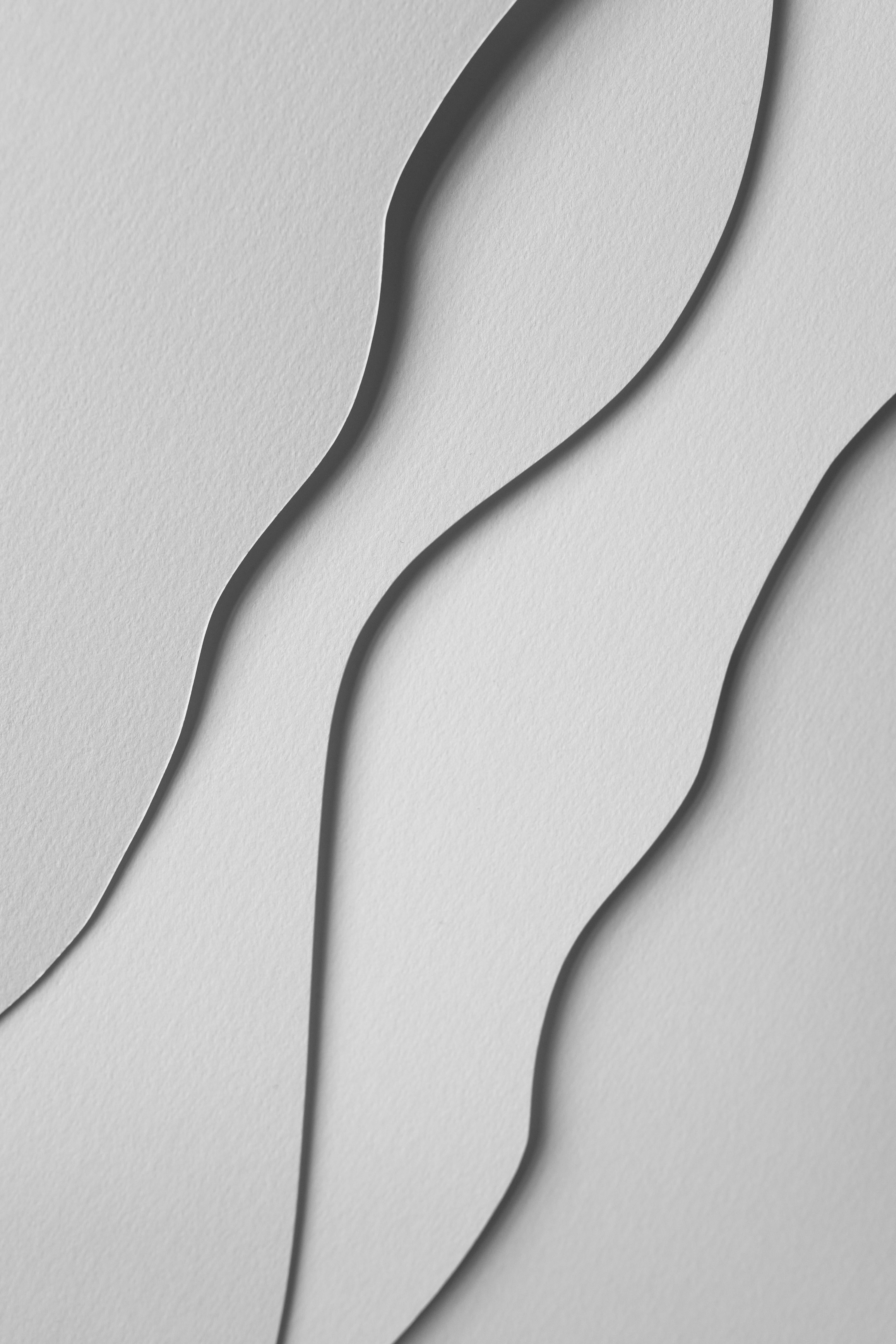 Spritzschutz-Abstrakte monochrome Papierwellen in Pastell