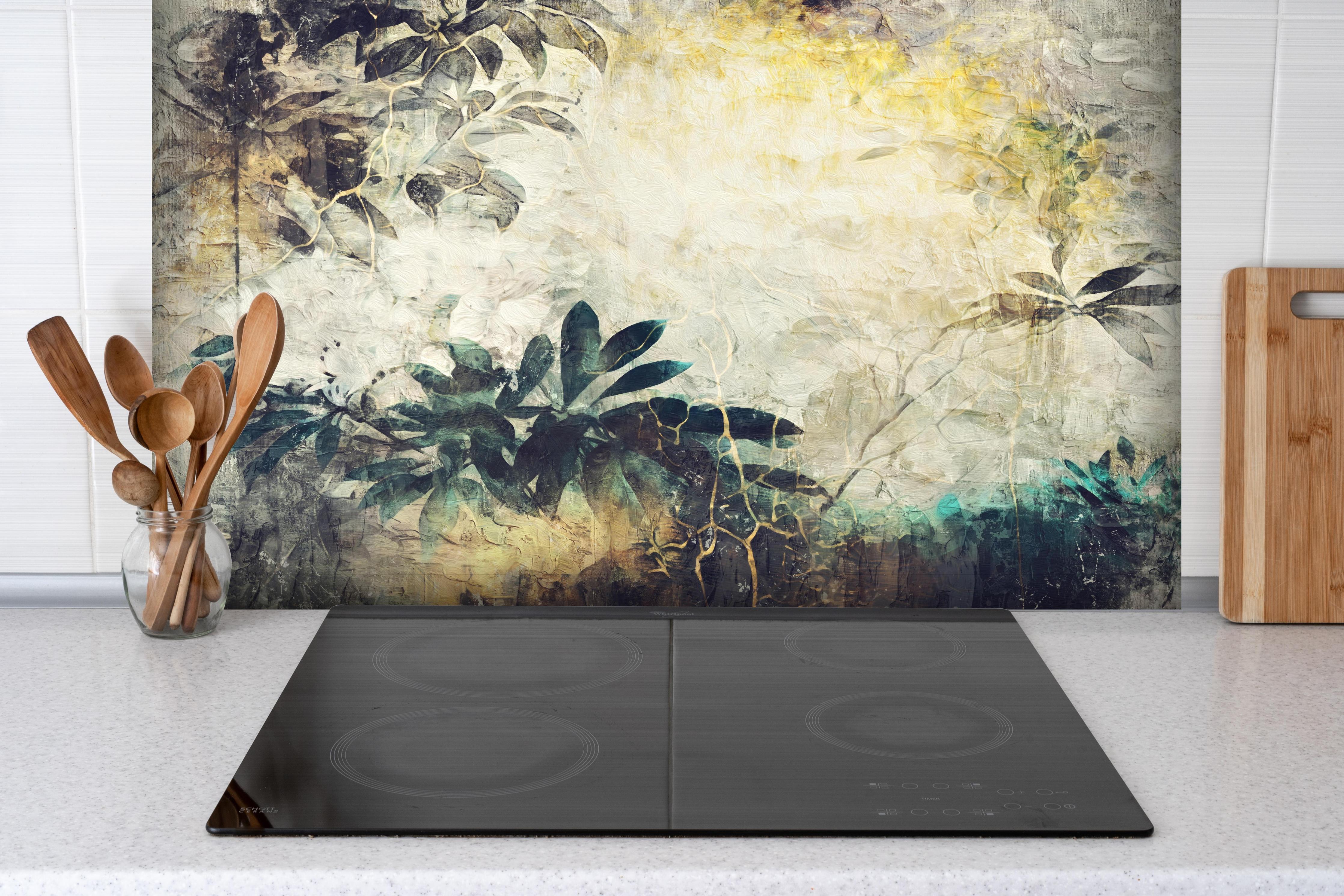 Spritzschutz - Baumzweig Gemälde hinter einem Cerankochfeld zwischen Holz-Kochutensilien