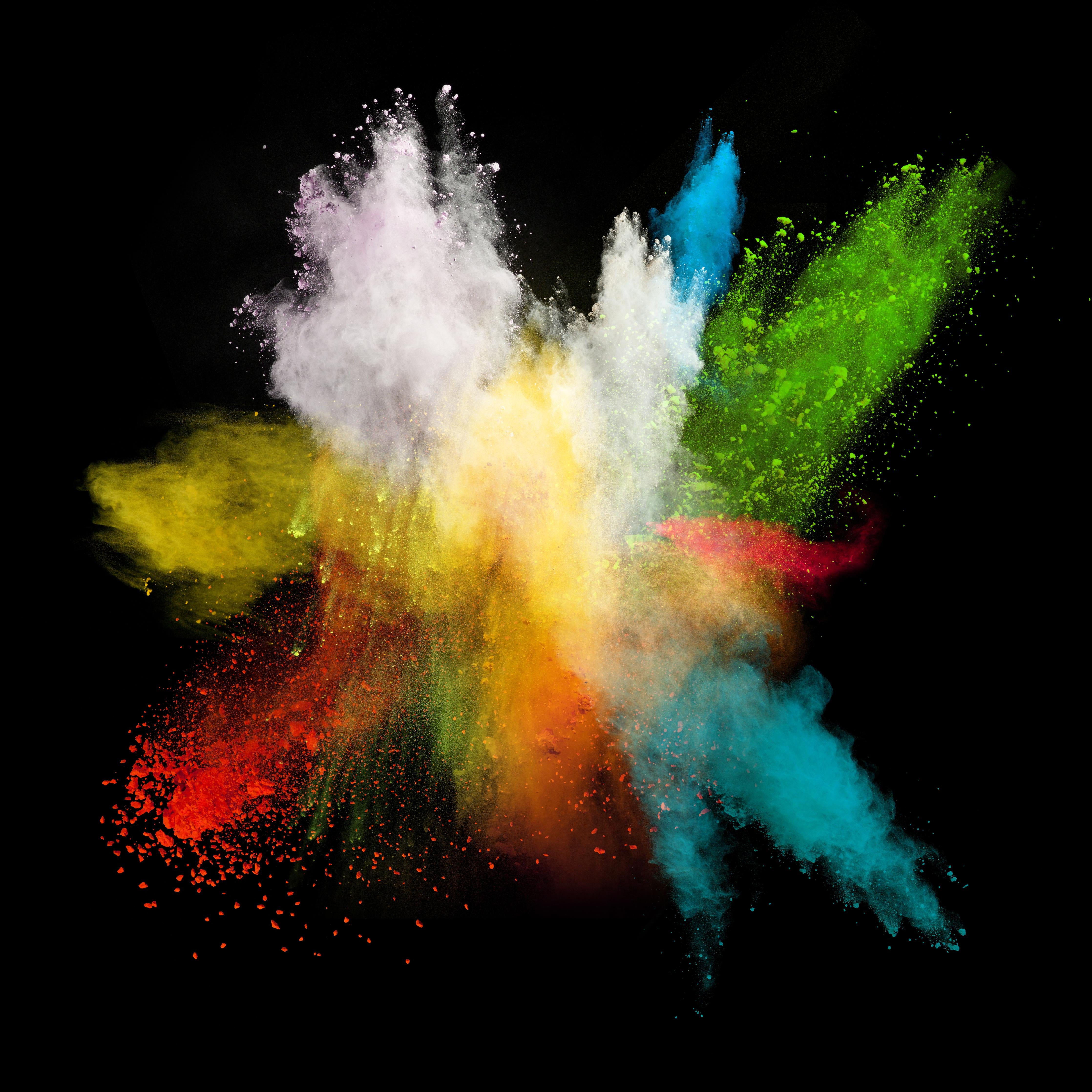 Spritzschutz-Bunte Farbexplosion auf schwarzem Hintergrund