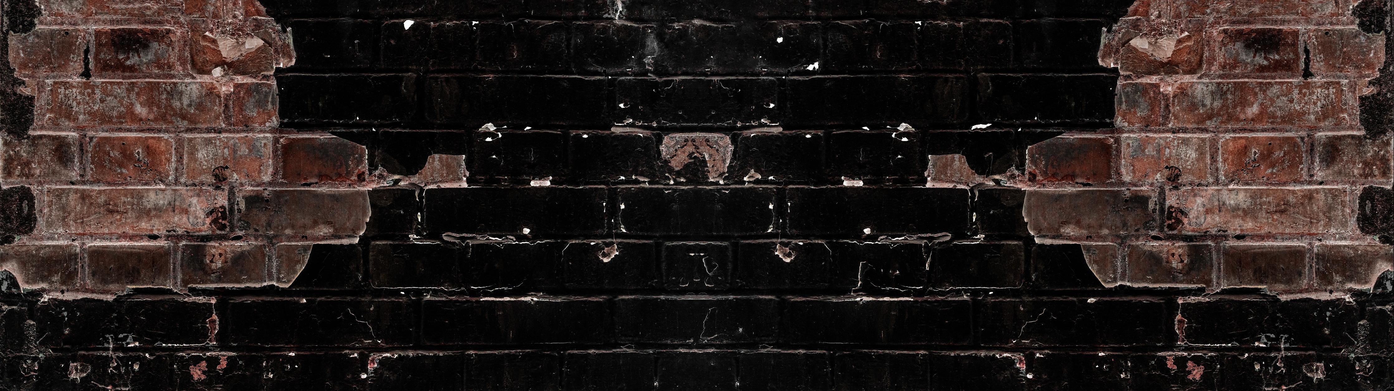 Spritzschutz-Dunkle beschädigte Ziegelwand