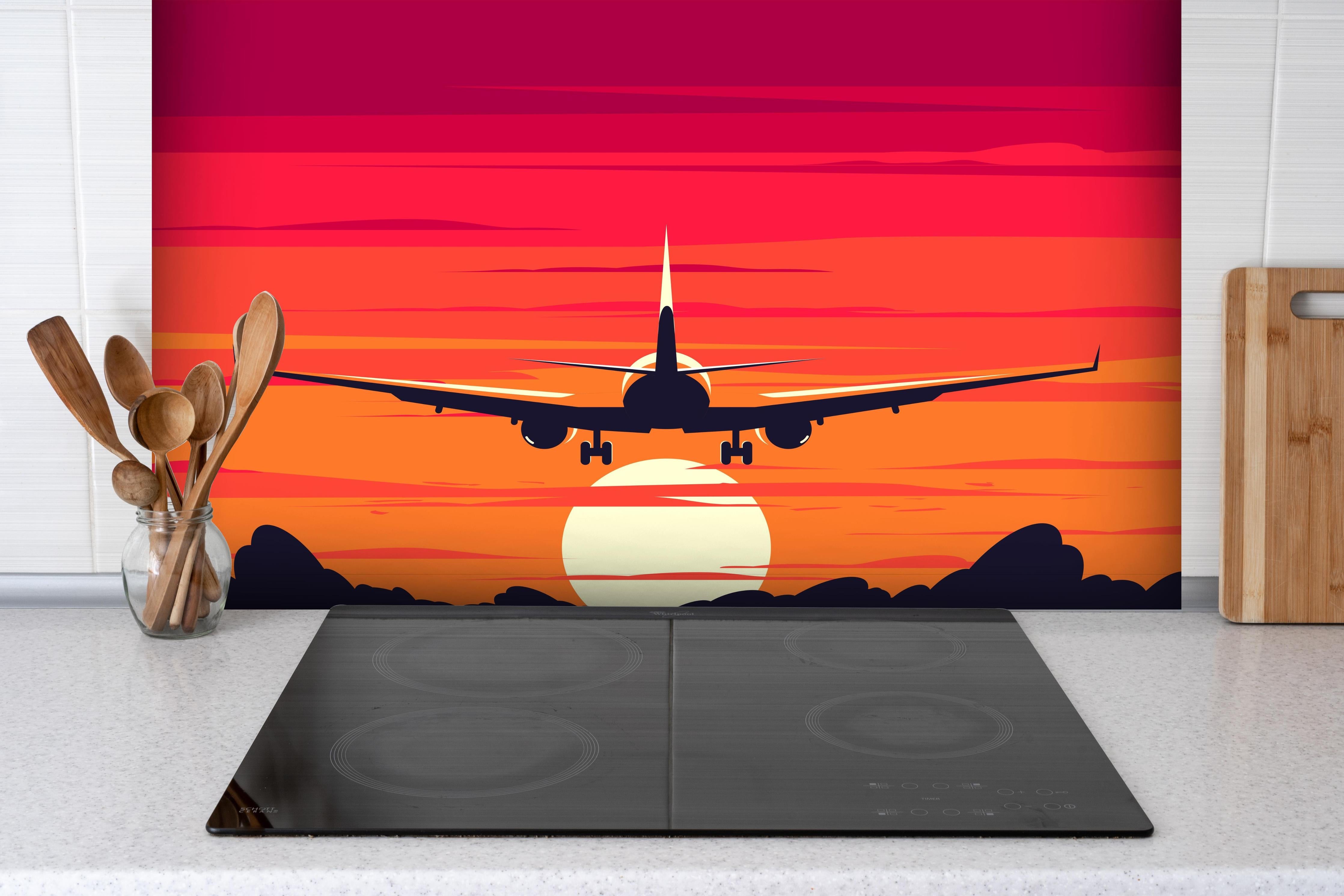 Spritzschutz - Flugzeug am Himmel beim Sonnenuntergang hinter einem Cerankochfeld zwischen Holz-Kochutensilien
