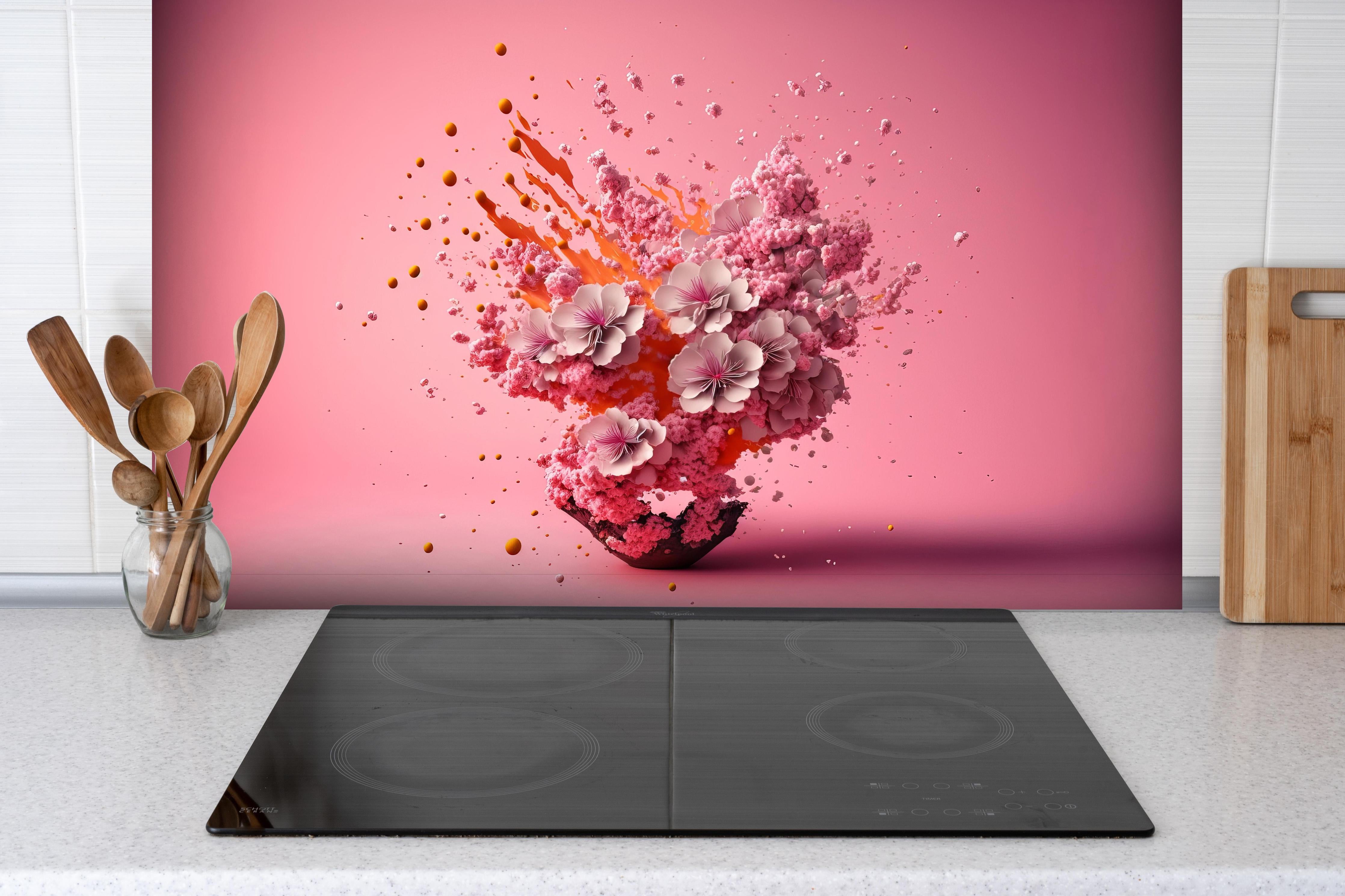 Spritzschutz - Kreative Kirschblüten Petalen Explosion hinter einem Cerankochfeld zwischen Holz-Kochutensilien