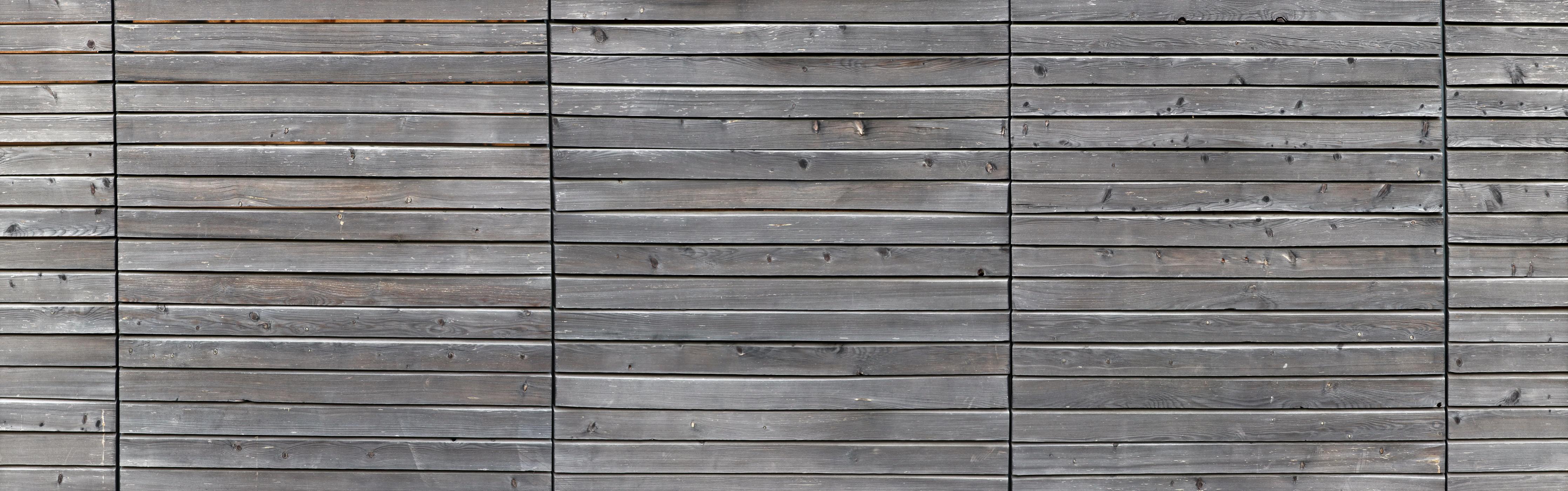 Spritzschutz-Langer grauer Holzzaun