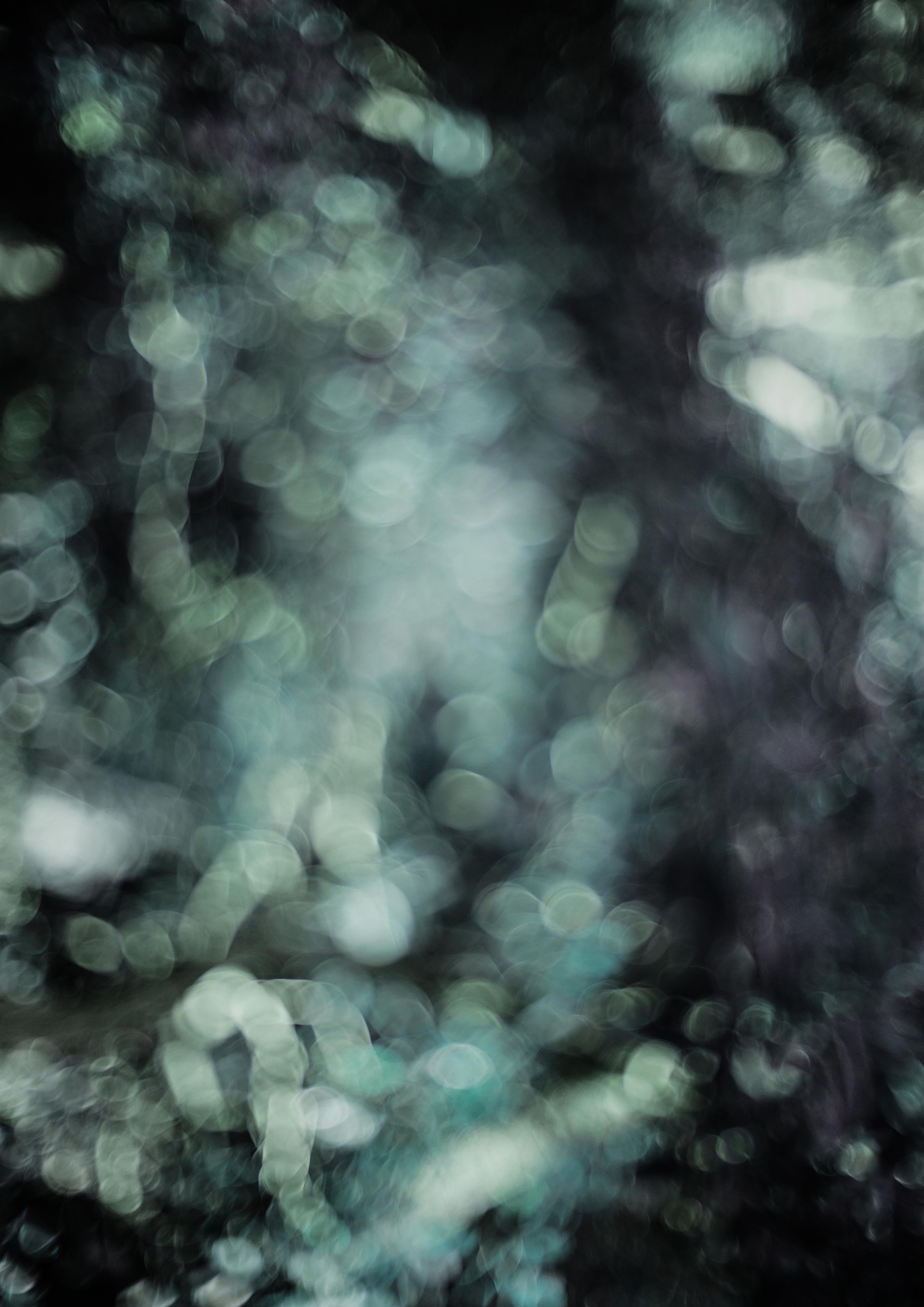 Spritzschutz-Mystischer Grünschimmer auf dunklem Grund