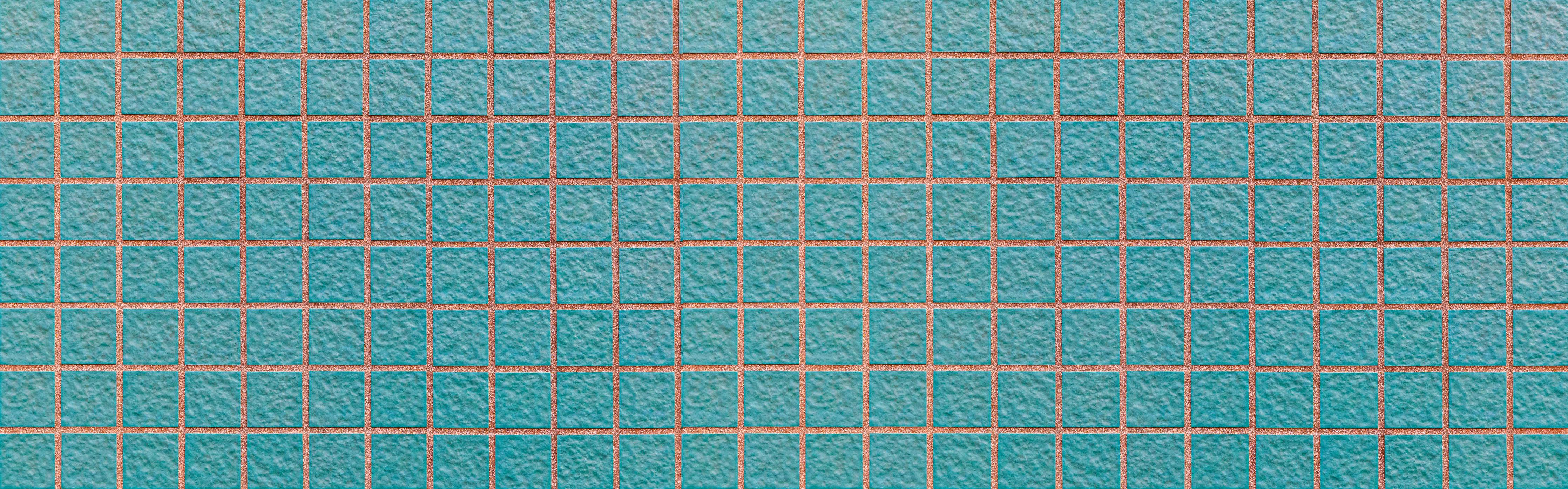 Spritzschutz-Panorama der hellblauen Steinblockwand