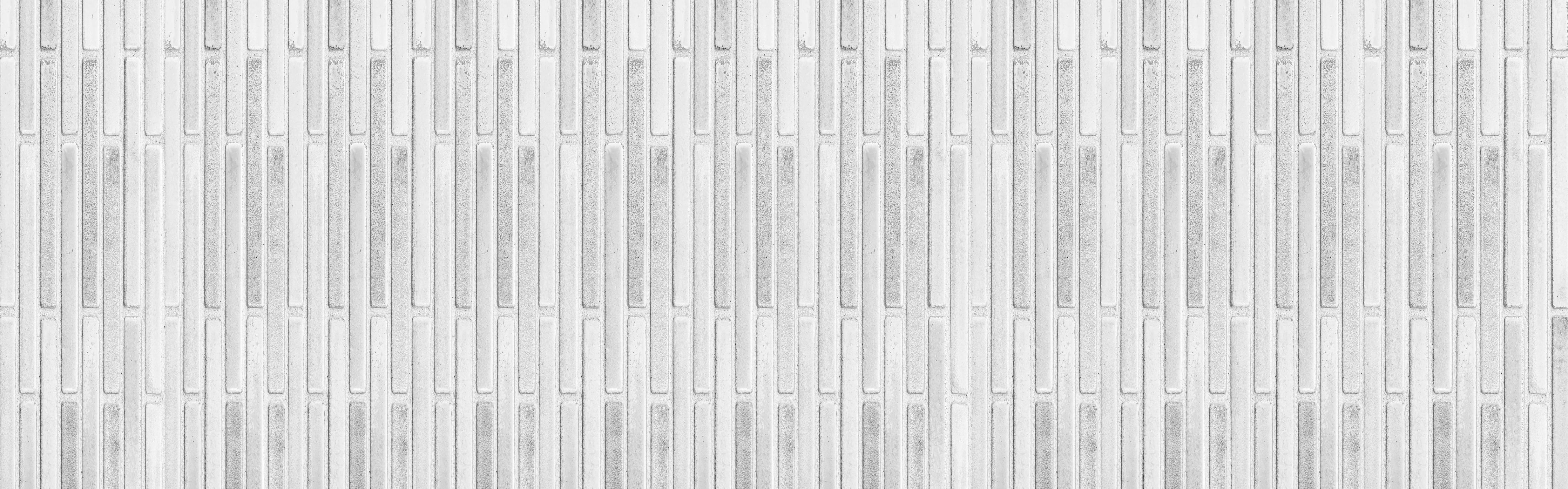 Spritzschutz-Panorama der weißen Steinwand mit Streifen Textur