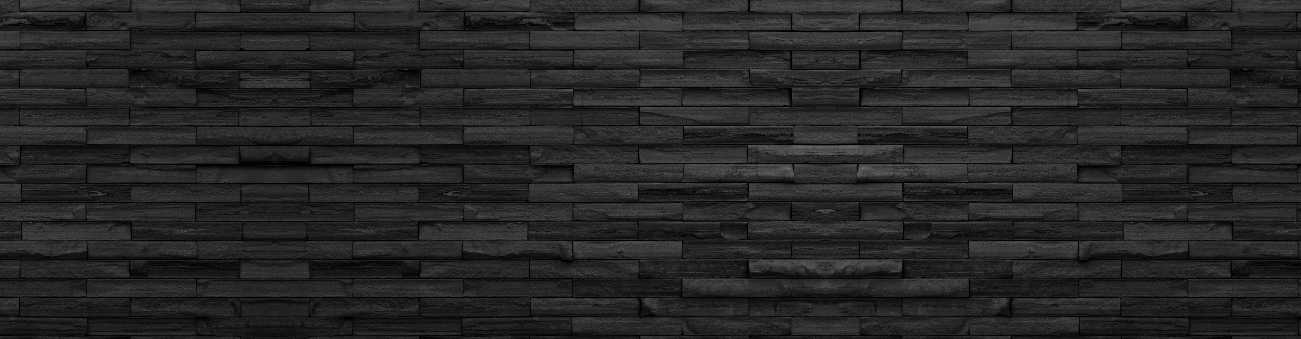 Spritzschutz-Panorama von schwarze Backsteinmauer