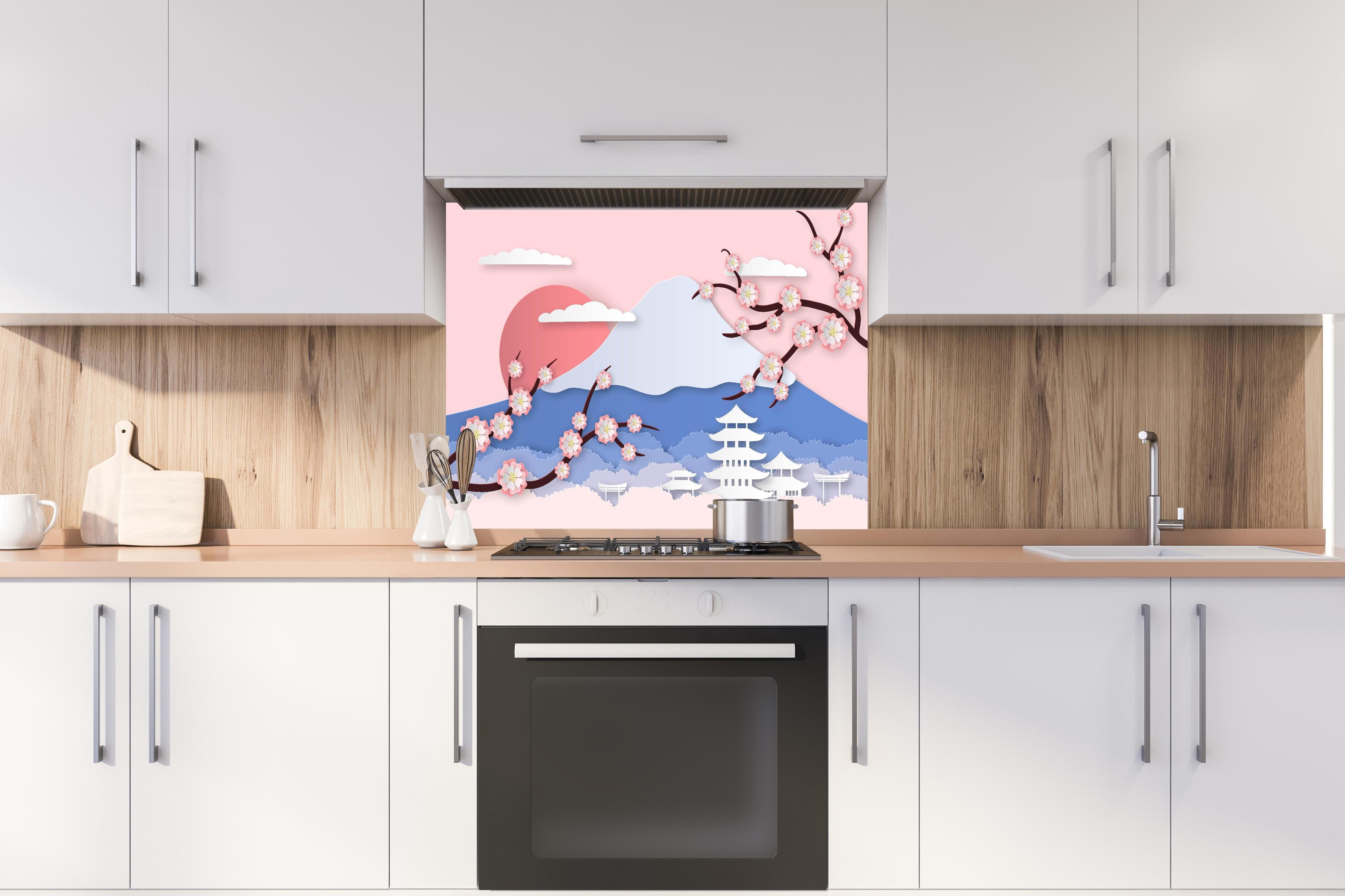 Spritzschutz - Papierkunst Japan Berge Sakura Sonnenuntergang hinter einem Cerankochfeld zwischen Holz-Kochutensilien