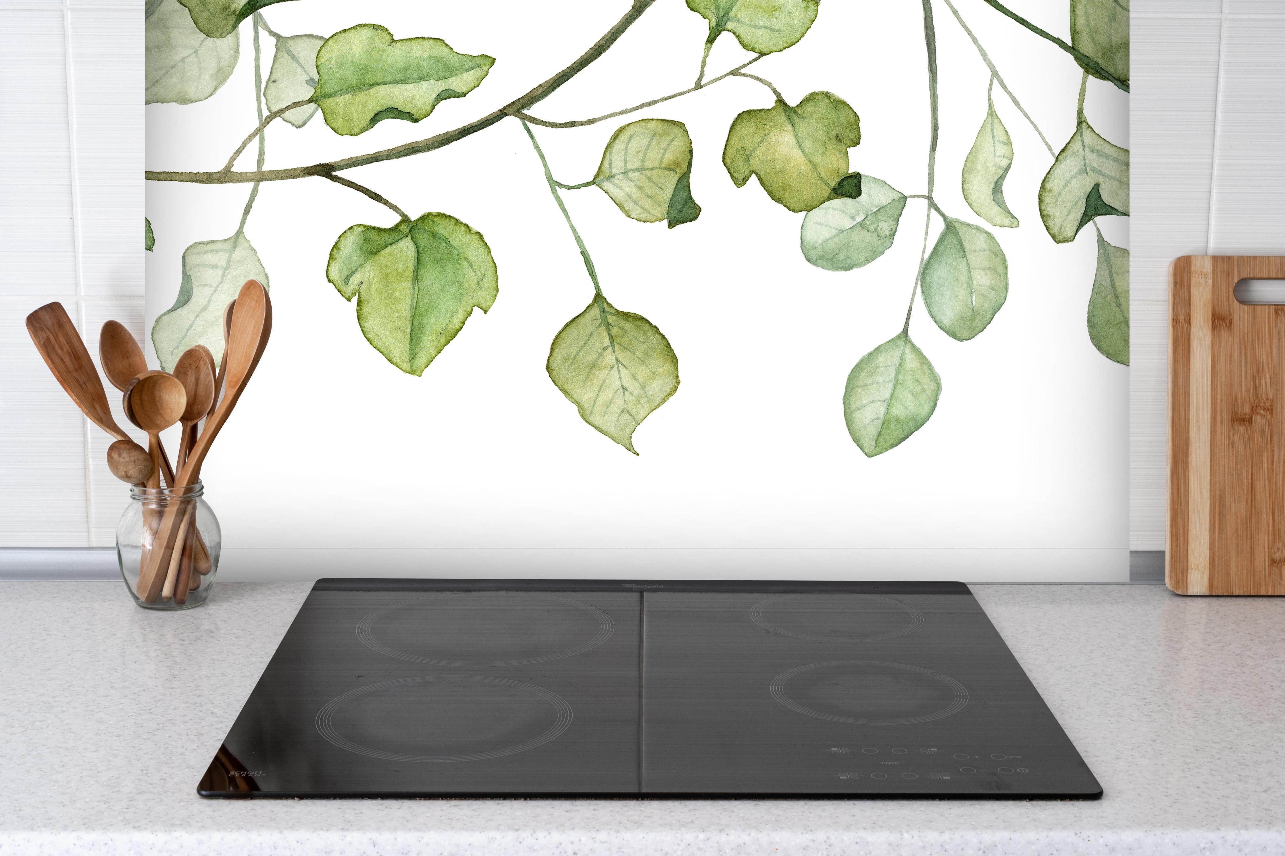 Spritzschutz - Hängende Blätter an Ästen Aquarell hinter einem Cerankochfeld zwischen Holz-Kochutensilien