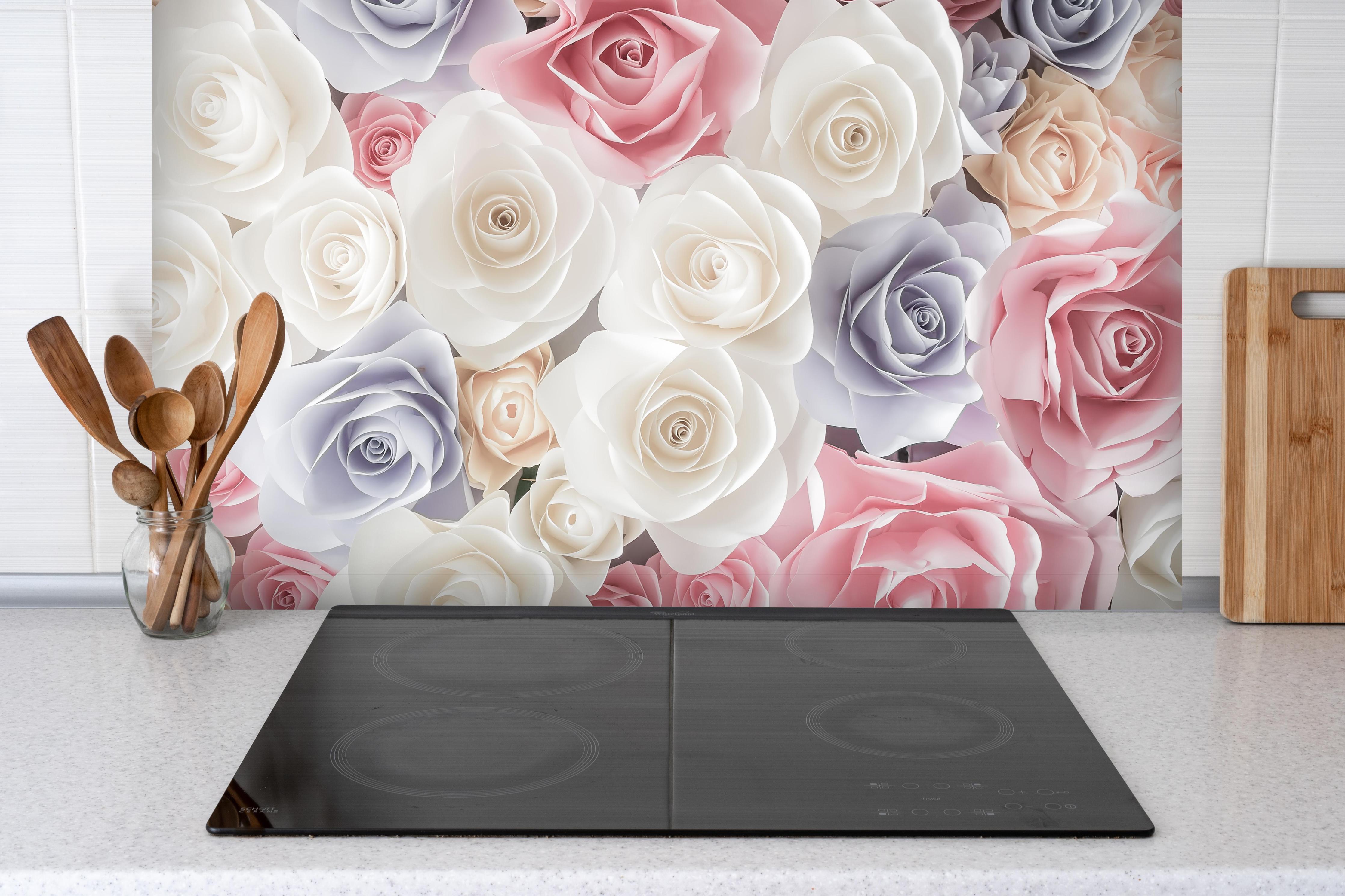 Spritzschutz - Kulisse aus bunten Papierrosen hinter einem Cerankochfeld zwischen Holz-Kochutensilien