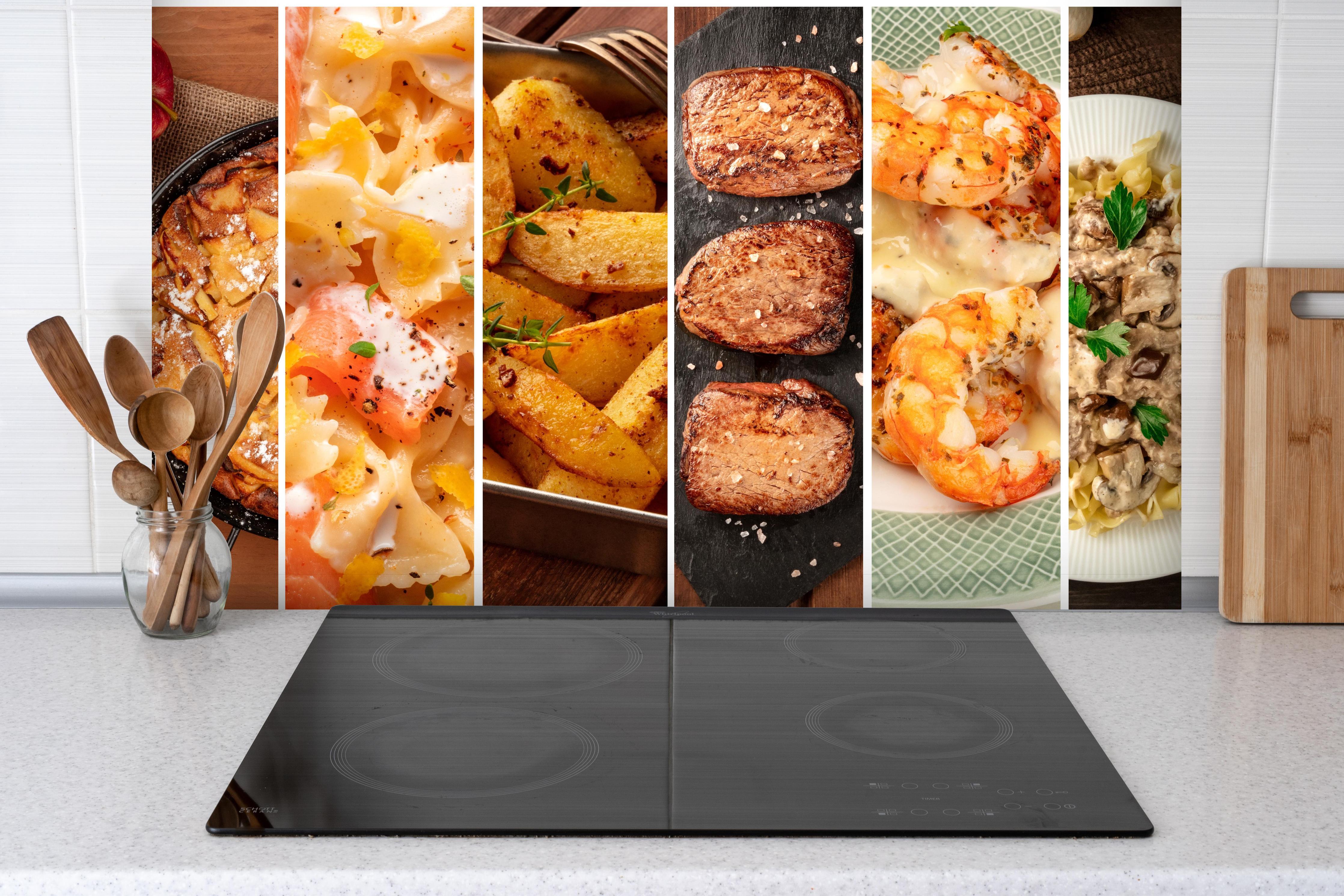 Spritzschutz - Leckere Gerichte hinter einem Cerankochfeld zwischen Holz-Kochutensilien