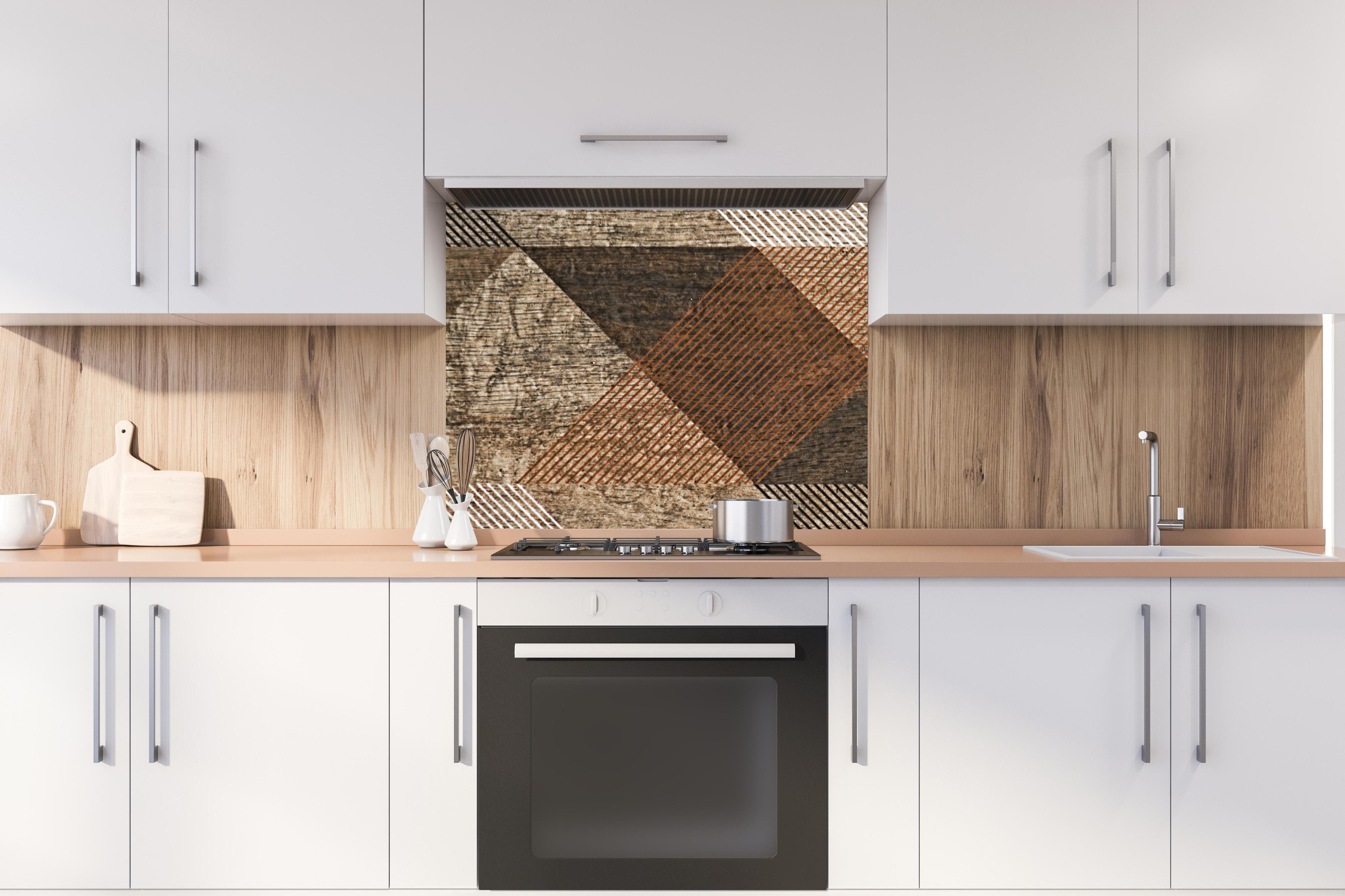 Spritzschutz - geometrisches Mosaik Design hinter stilvollem Gasherd unter Dunstabzugshaube
