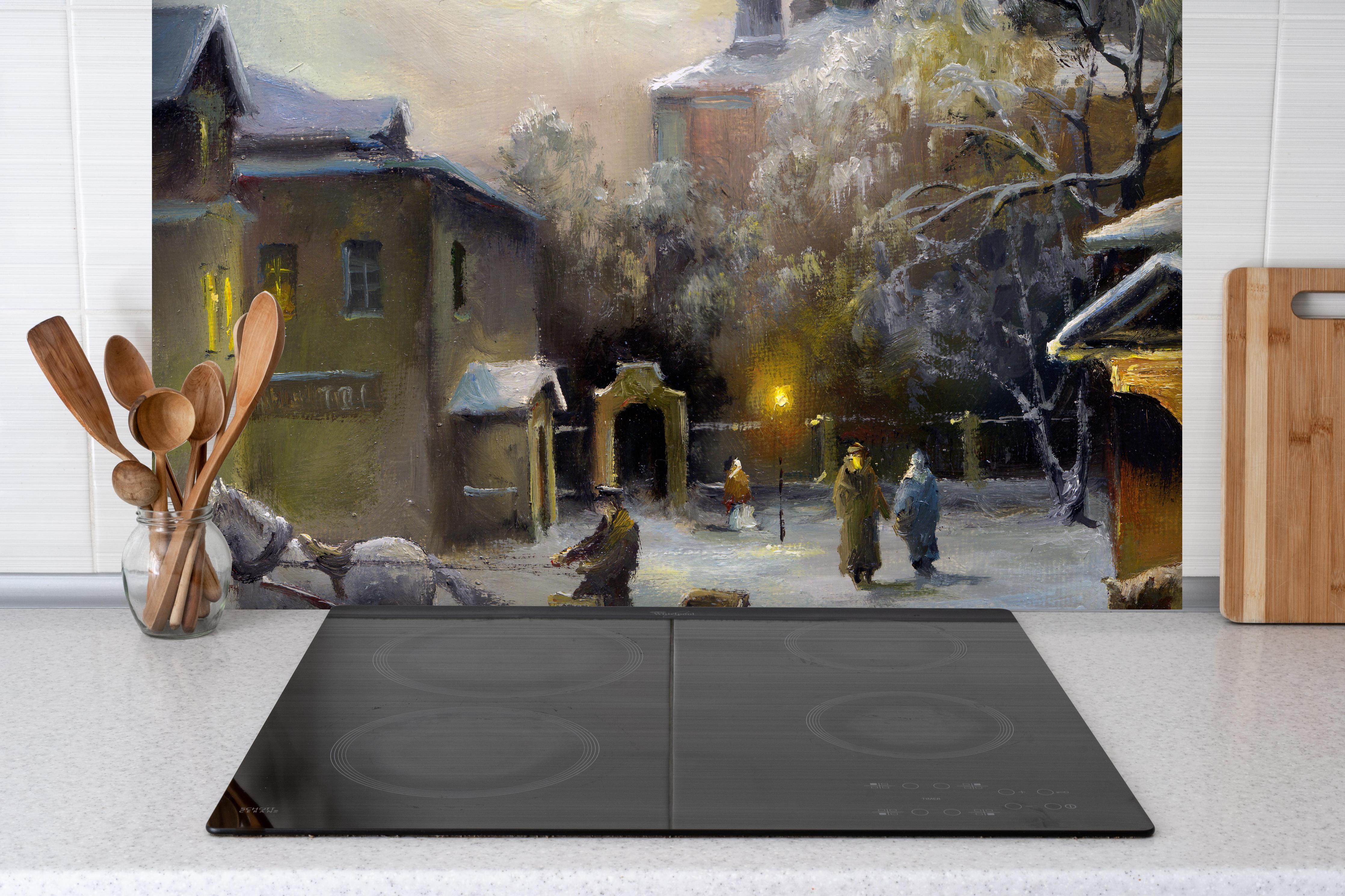 Spritzschutz - ländliches Dorf im Winter hinter einem Cerankochfeld zwischen Holz-Kochutensilien