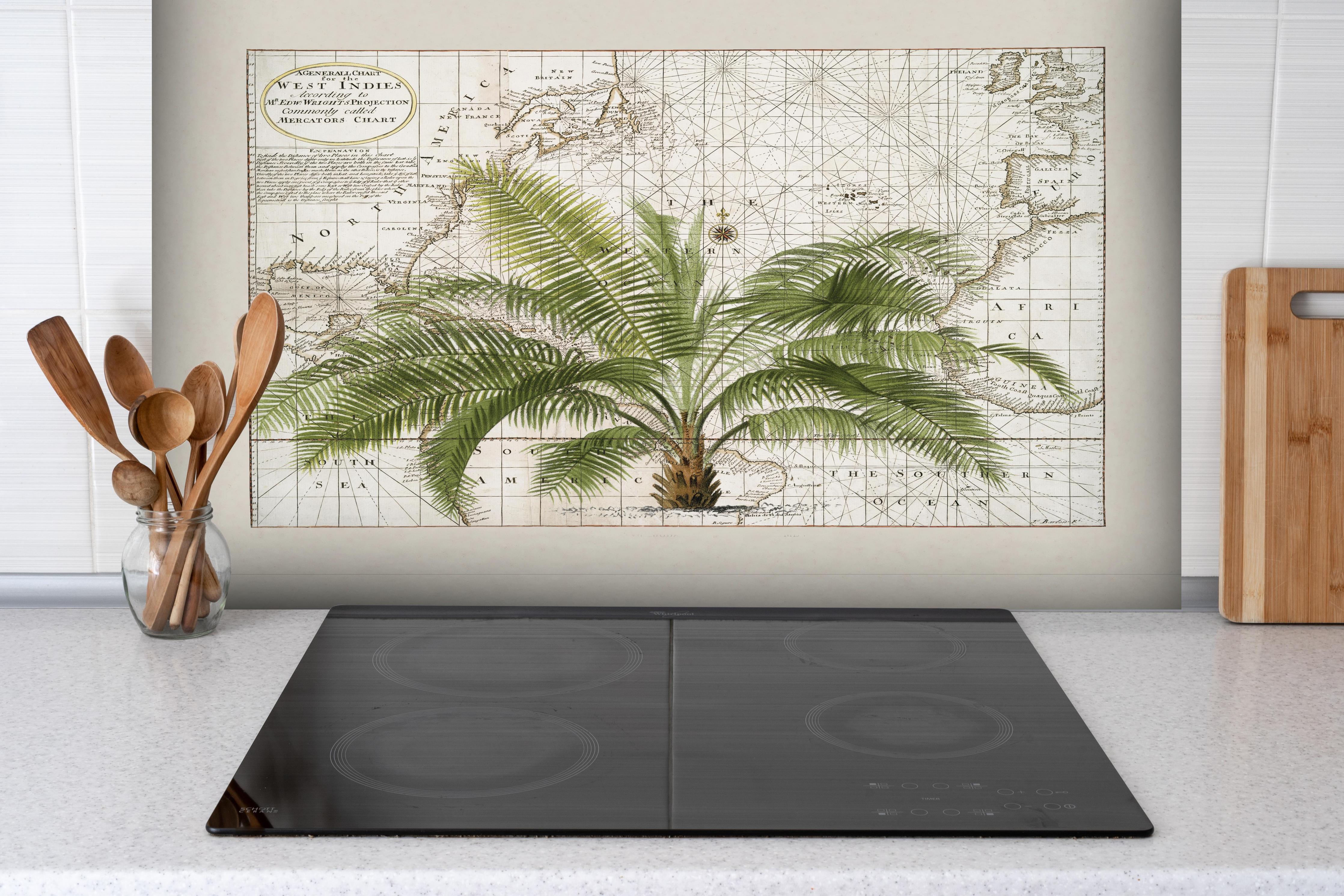 Spritzschutz - Tropical Empire No1 hinter einem Cerankochfeld zwischen Holz-Kochutensilien