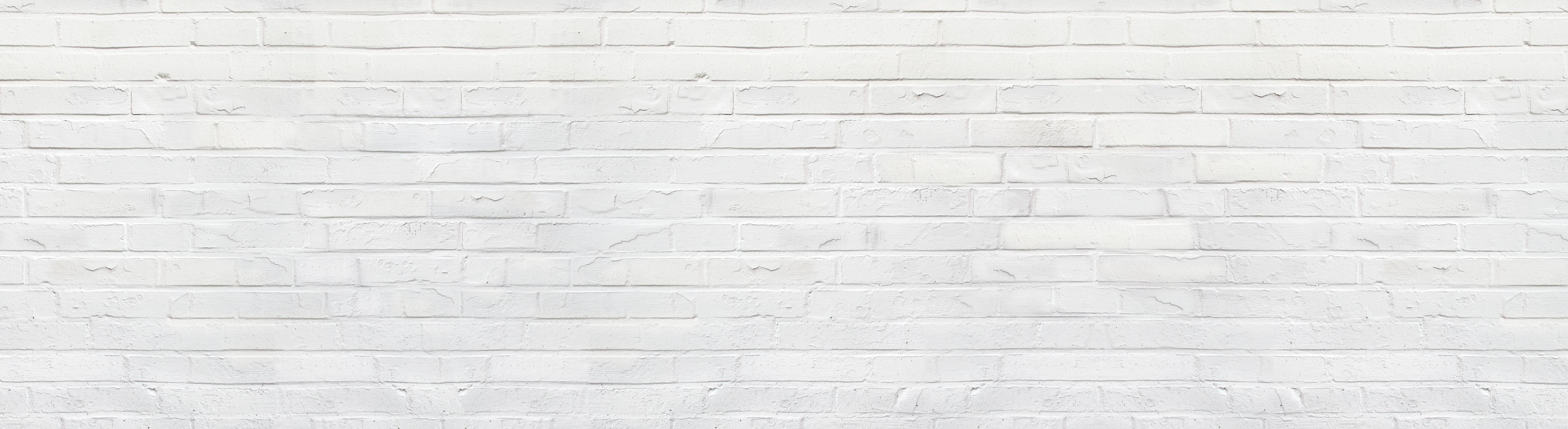 Spritzschutz-Weiße zerschlagene Ziegelsteinmauer