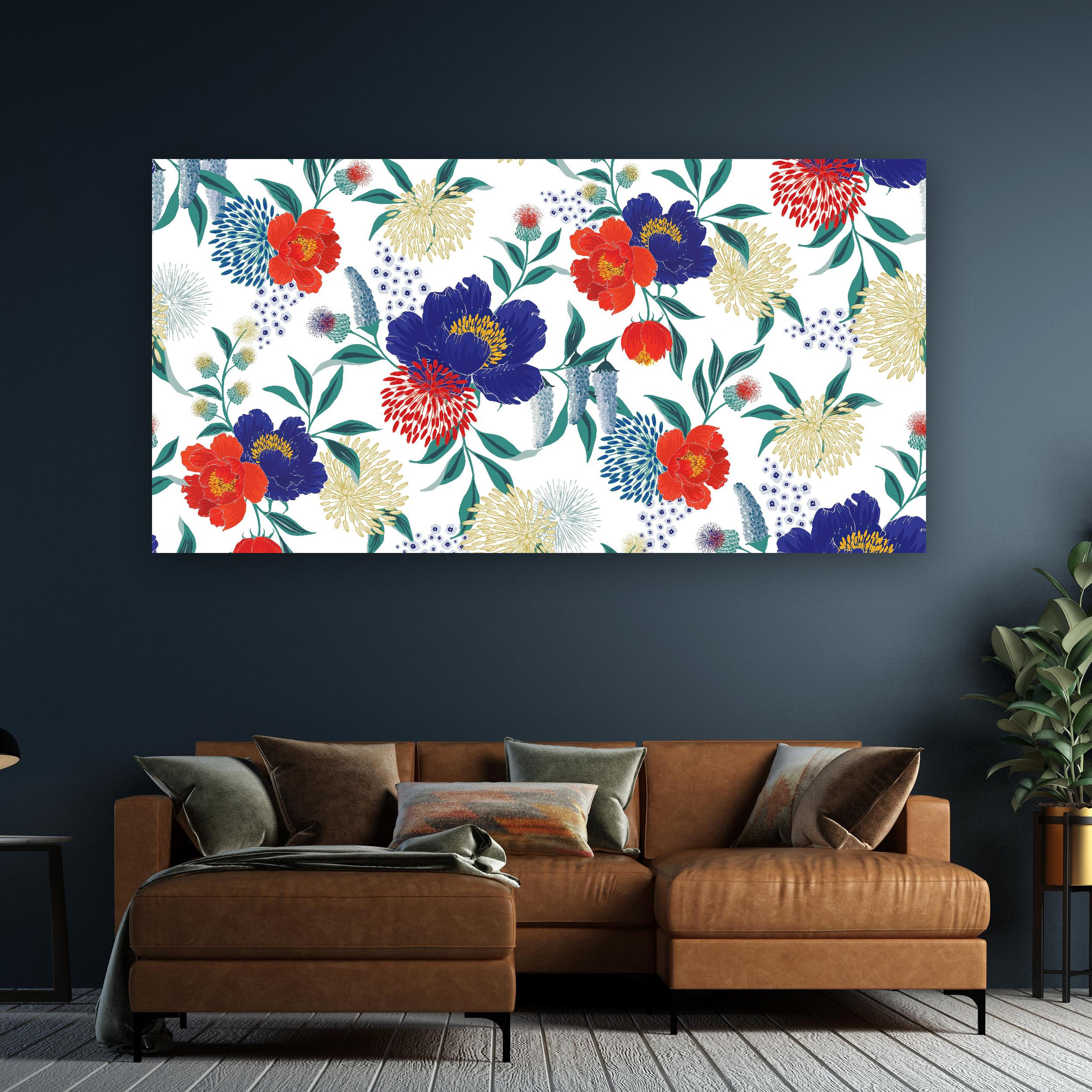 Wandbild - Bunte Blumenmuster Wandtapete Design hinter sanfter Couch mit cremefarbenen großen Kissen Zoom