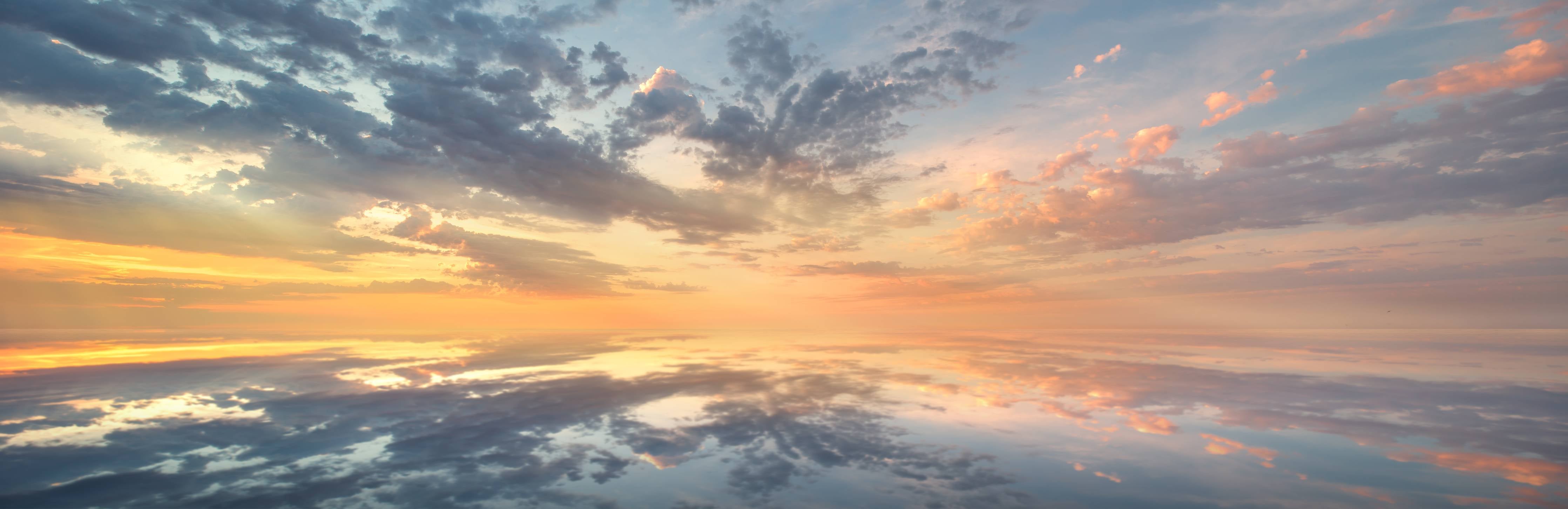 Wandverkleidung Bad-Leuchtender Sonnenuntergang über Wasser