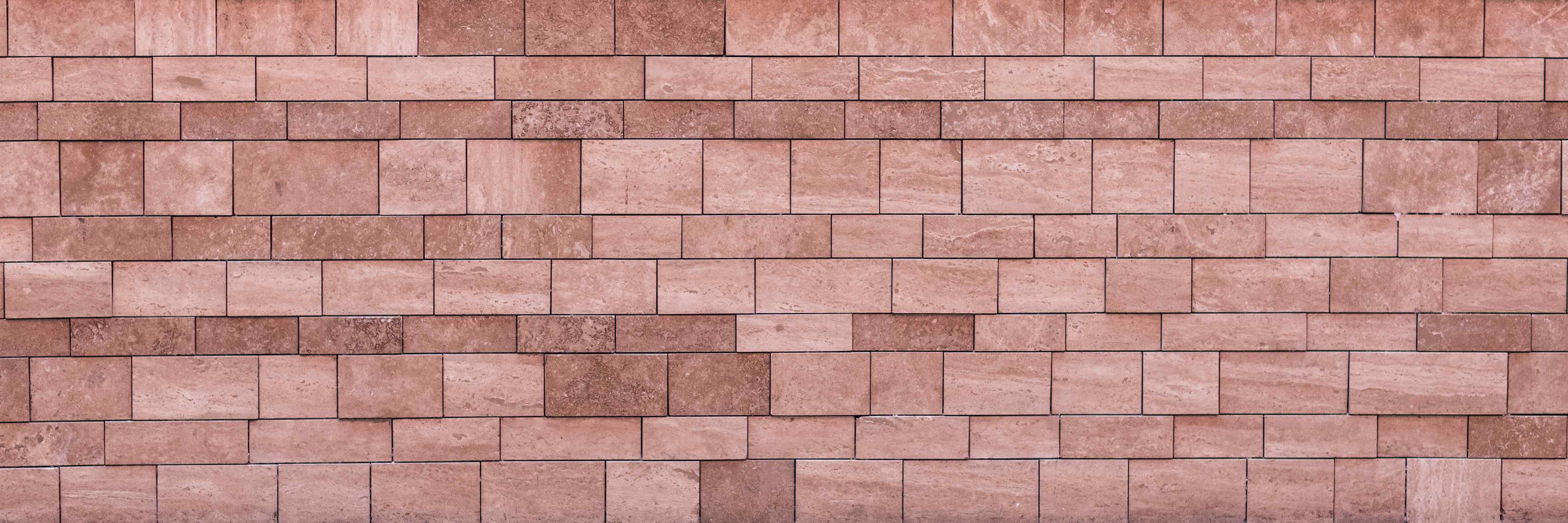 Wandverkleidung Bad-Rustikale Mauerstein-Wand in warmen Rottönen