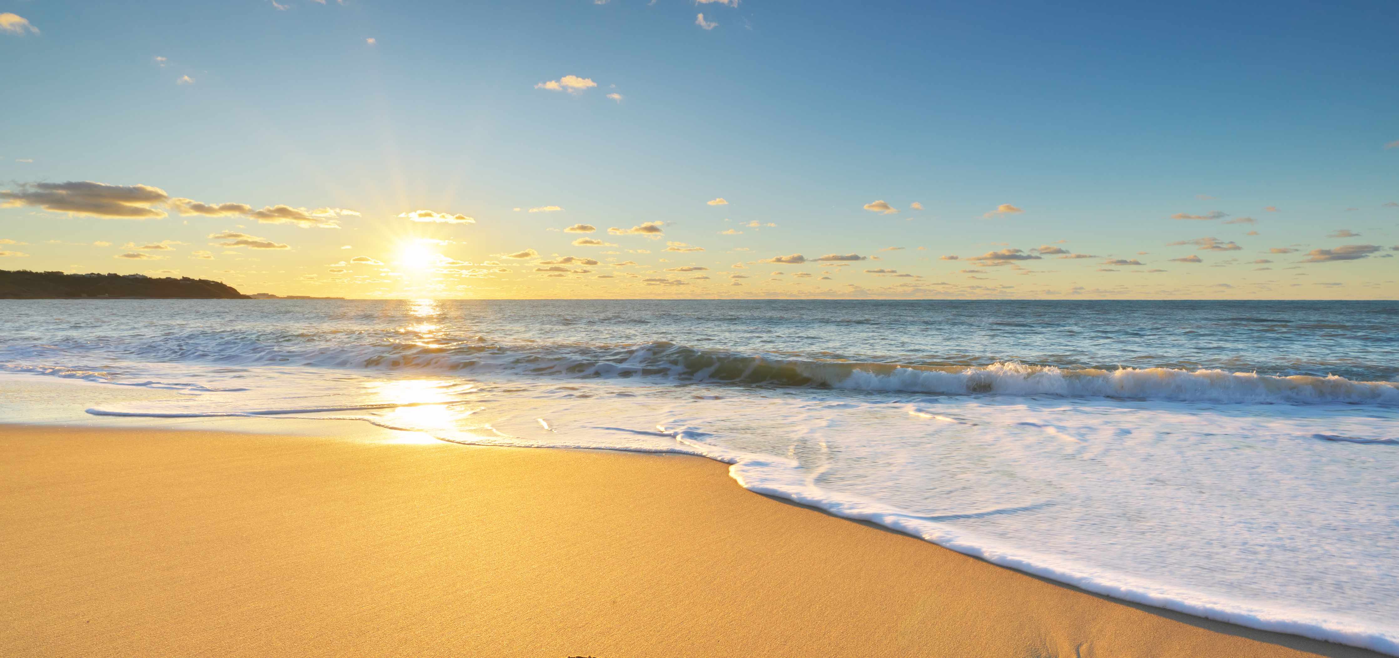 Wandverkleidung Bad-Strand bei Sonnenuntergang mit warmen Tönen