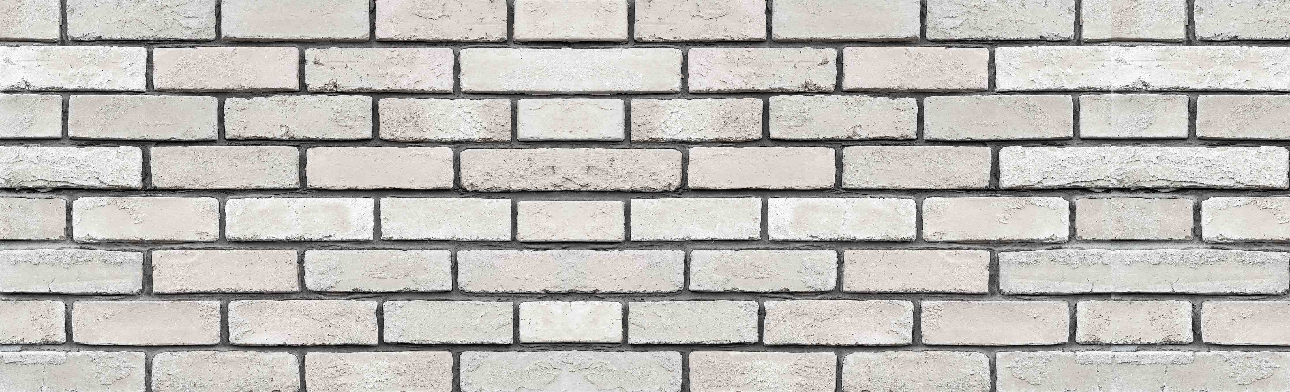 Wandverkleidung Bad-Weiße Backsteinwand mit dunklen Fugen