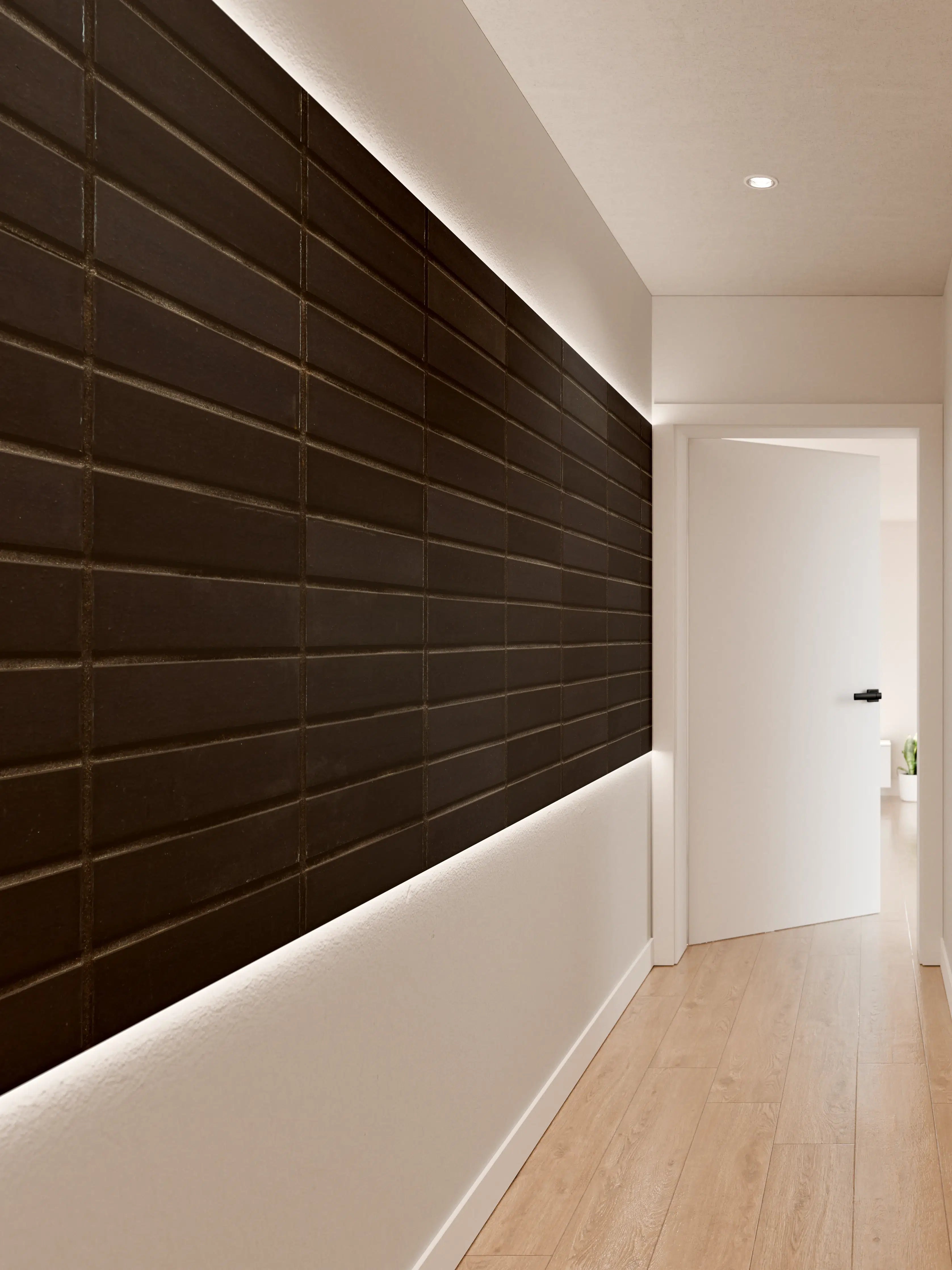 Wandverkleidung Flur - Schwarze Backsteinmauer mit goldener Akzent