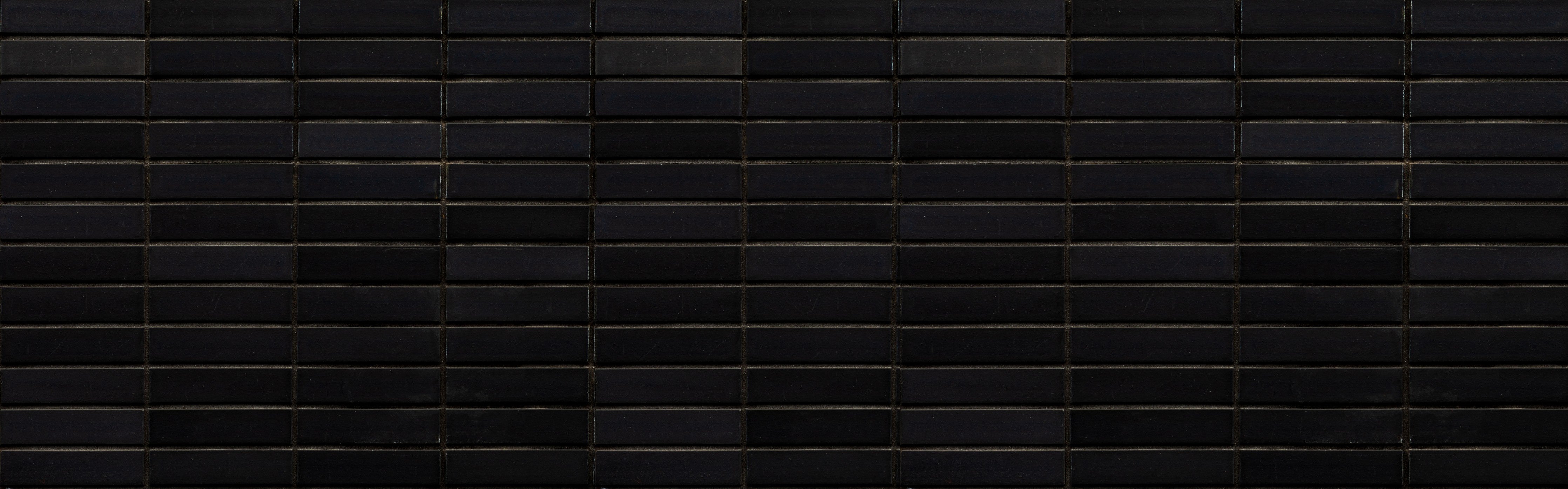Wandverkleidung Schlafzimmer-Schwarze Backsteinmauer mit goldener Akzent