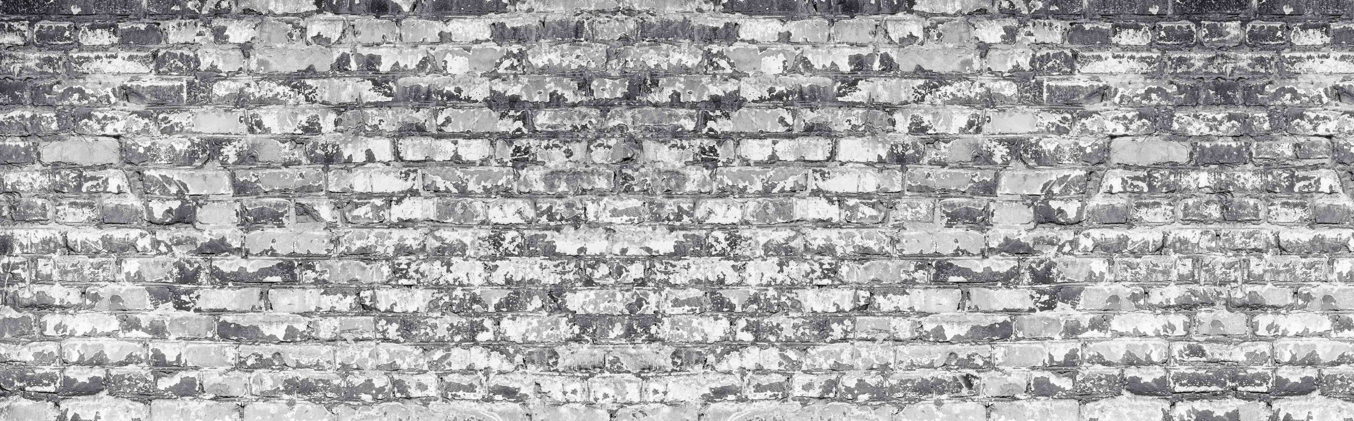 Wandverkleidung Wohnzimmer- Hellgraue verwitterte Vintage Ziegelwand