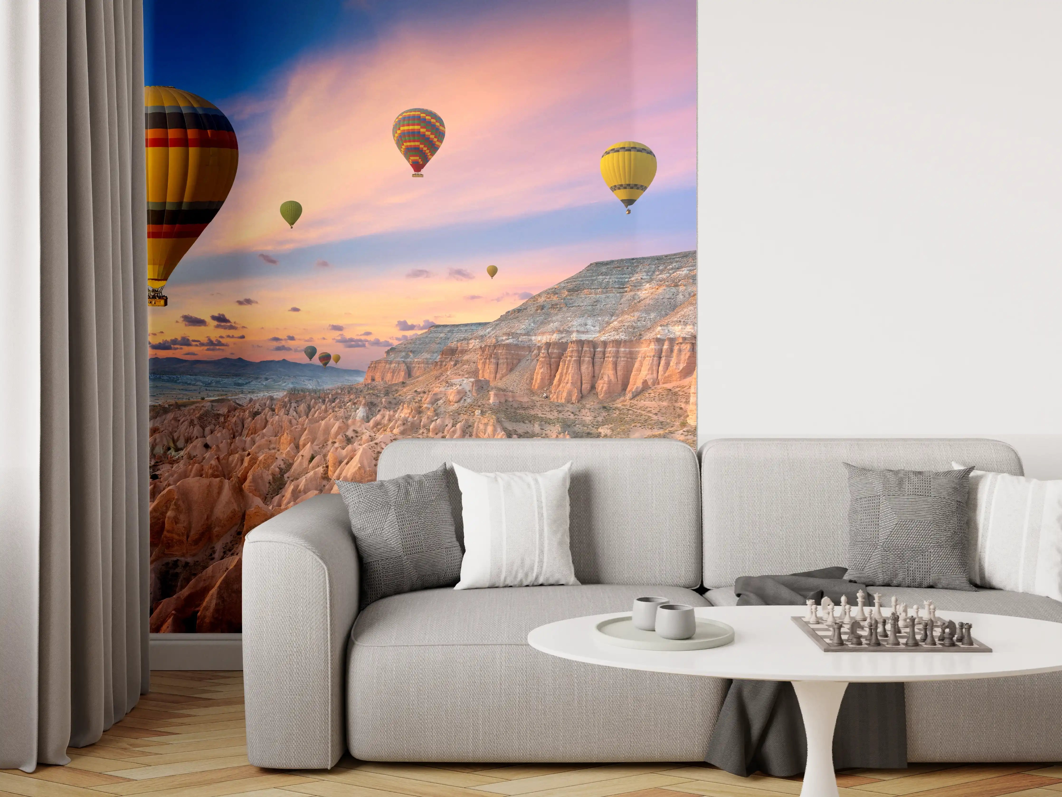 Wandverkleidung Wohnzimmer - Bunte Heißluftballons über atemberaubender Landschaft