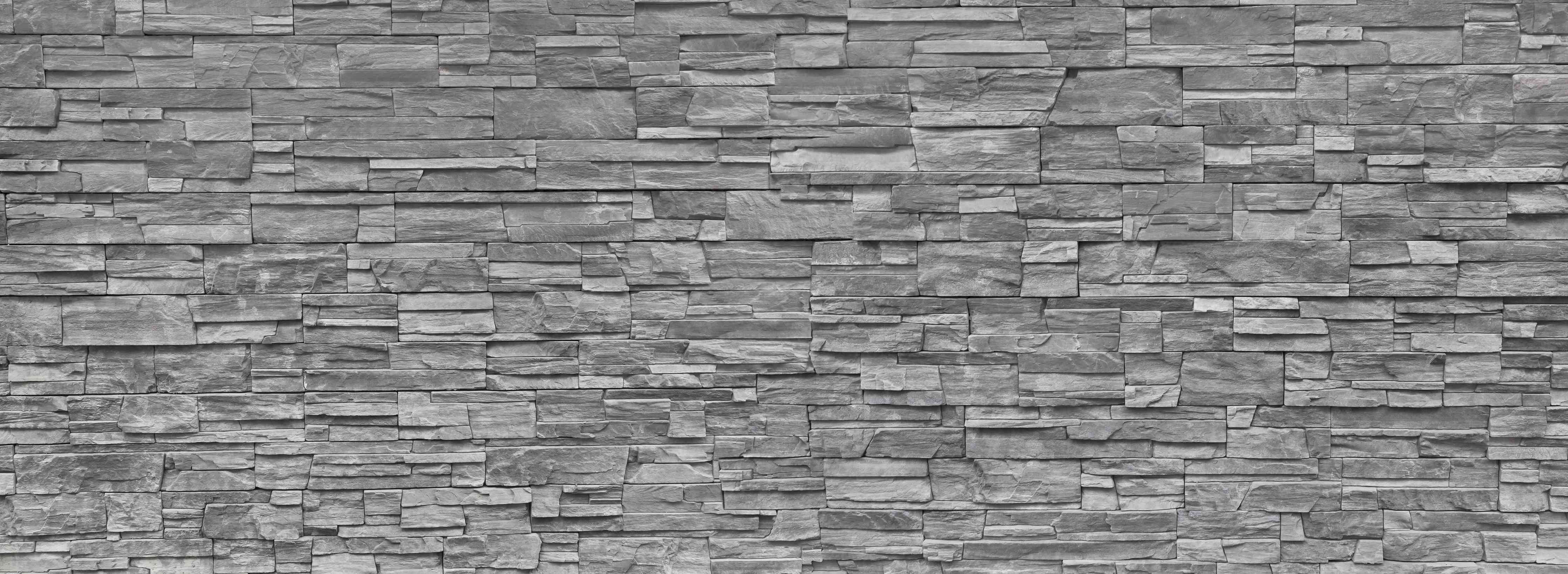 Wandverkleidung Wohnzimmer-Graue Steinwand