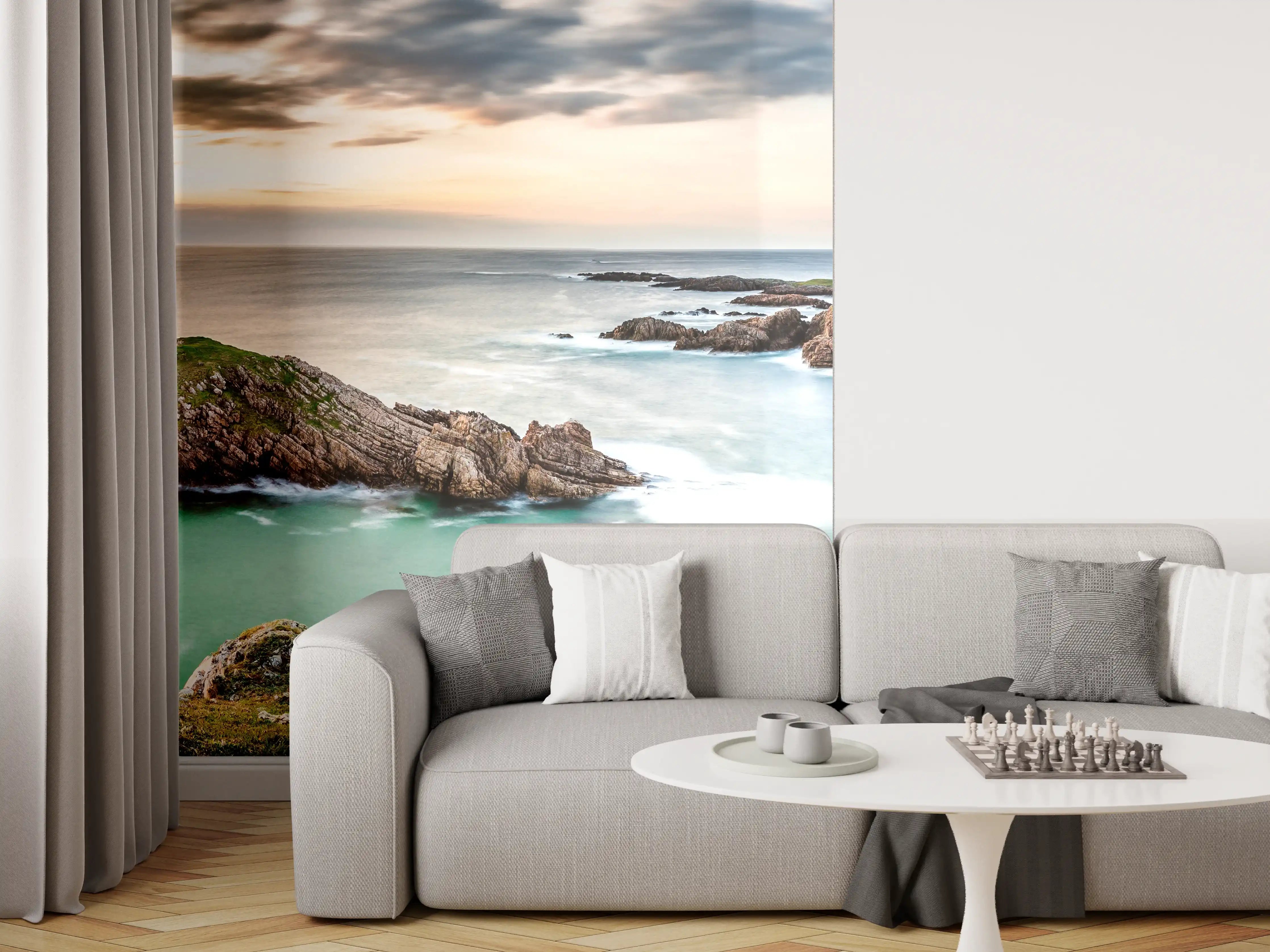 Wandverkleidung Wohnzimmer - Majestätischer Küstenblick bei Sonnenuntergang mit Felsen und Wasser