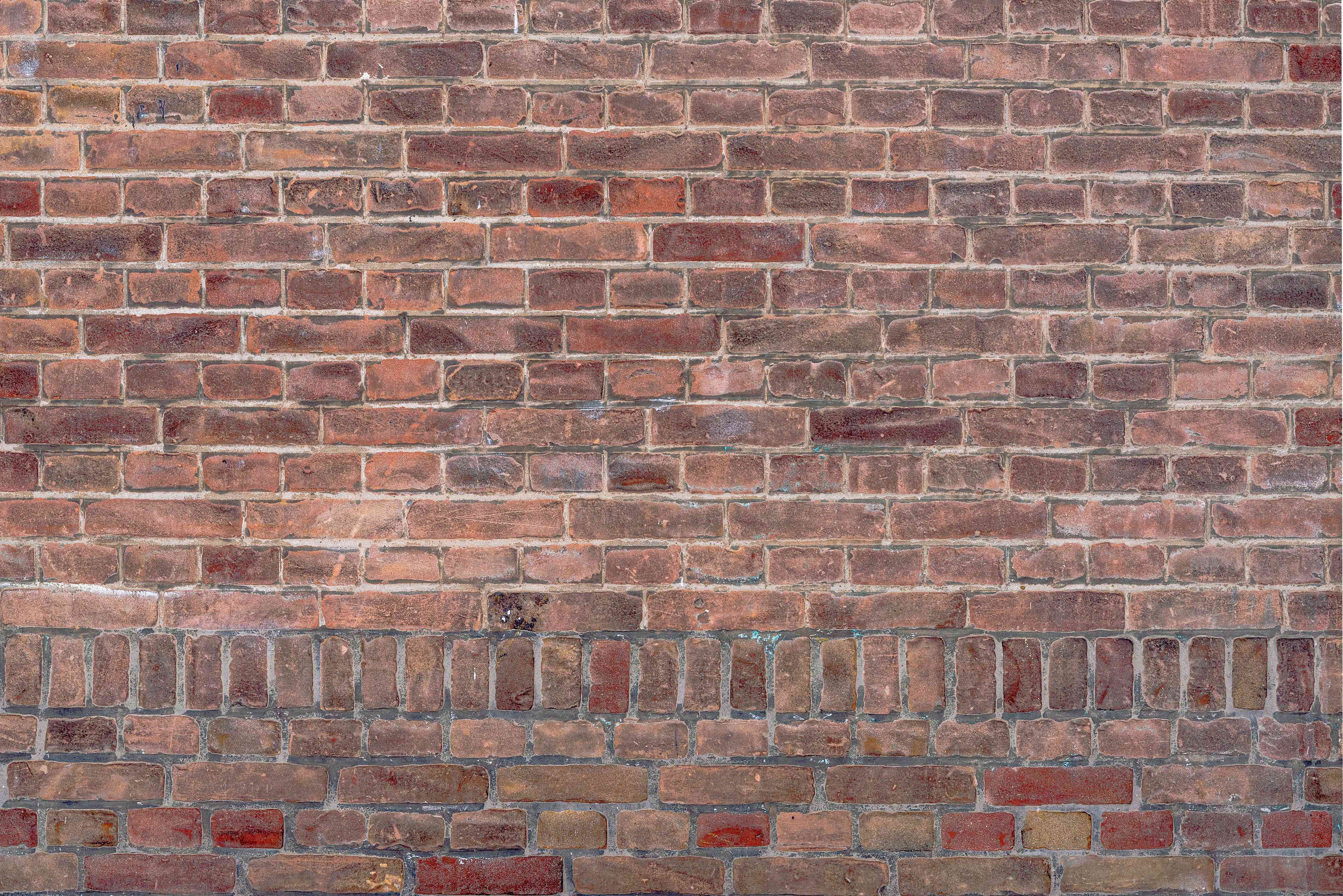 Wandverkleidung Wohnzimmer-Mauerstruktur aus alten braunen Ziegeln