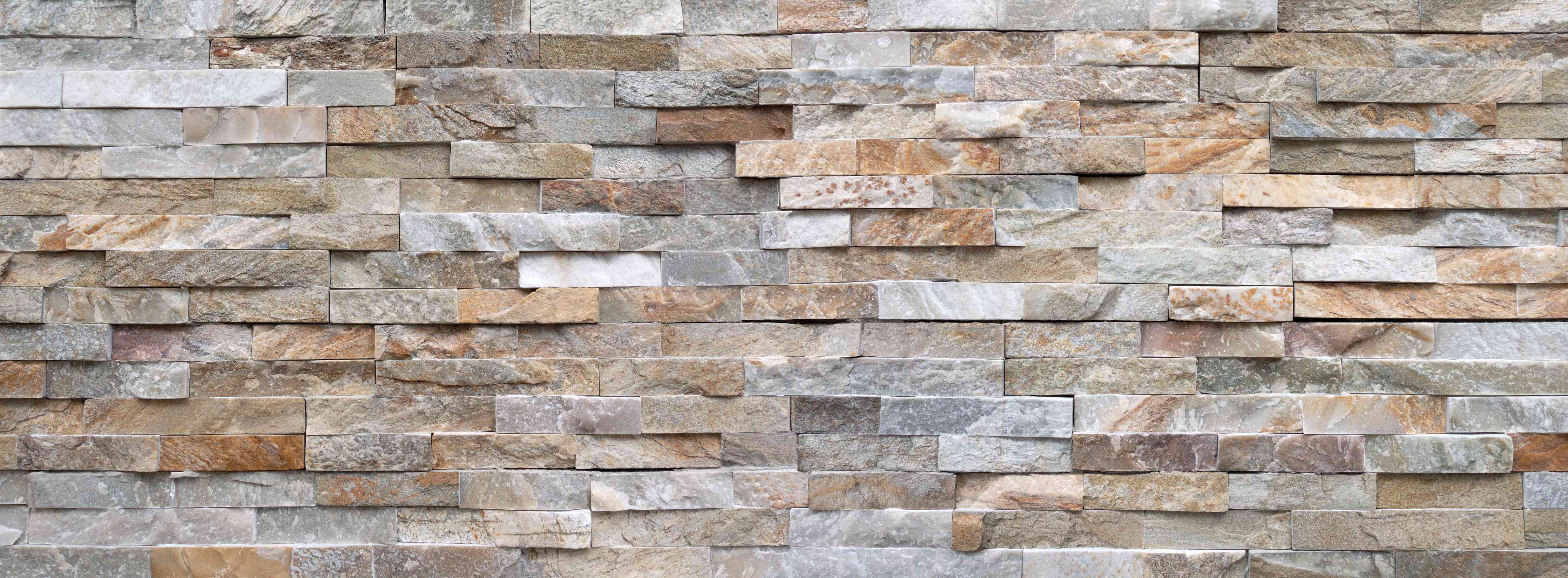 Wandverkleidung Wohnzimmer-Pastellfarbige Steinmauer