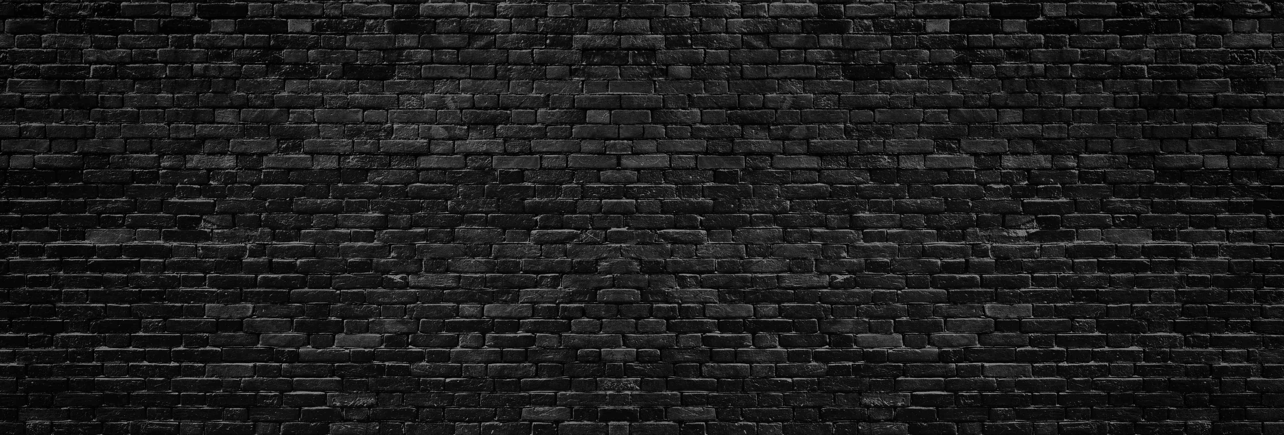 Wandverkleidung Wohnzimmer-Schwarze raue Ziegelwand